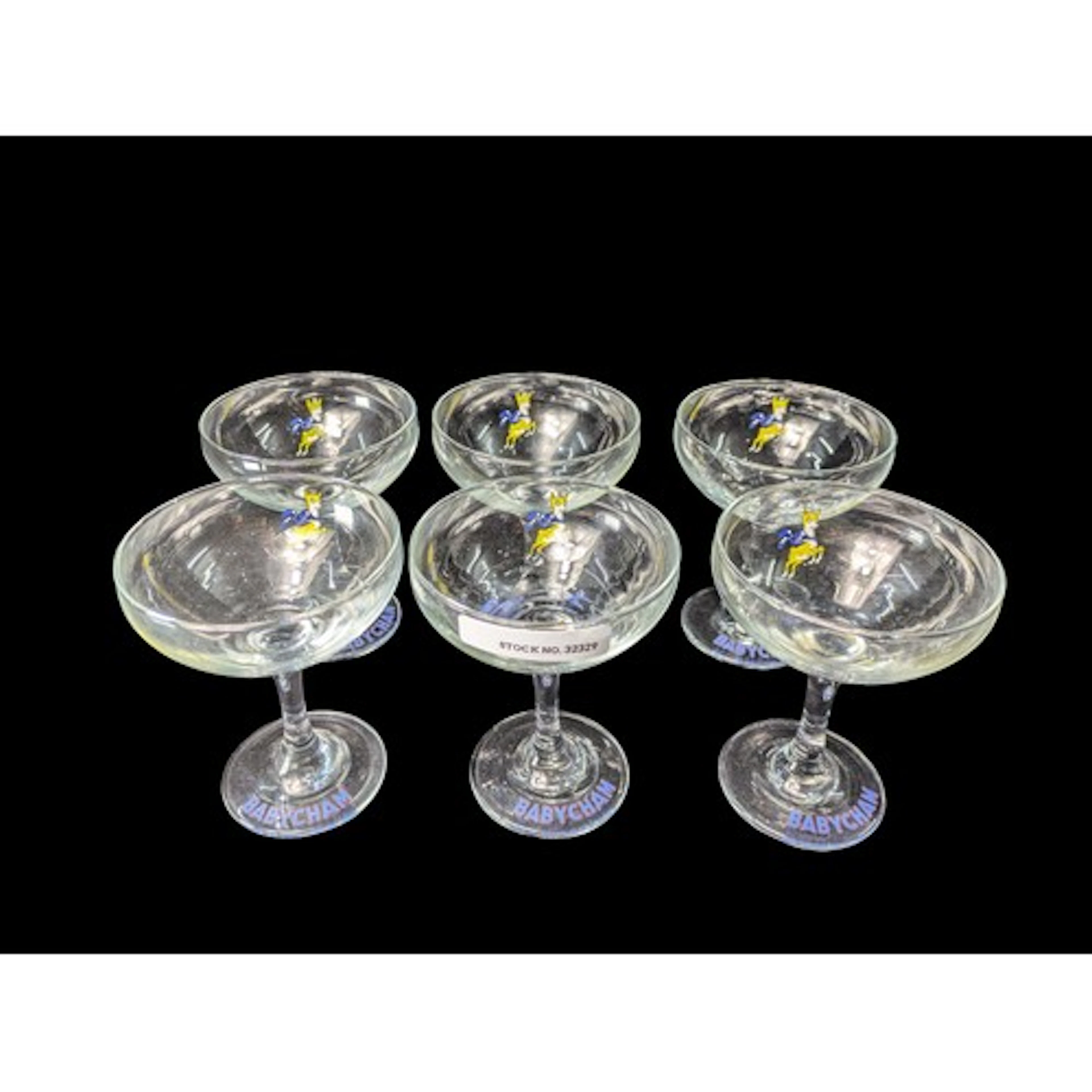 A set of Babycham advertising champagne coupes, each with a ...