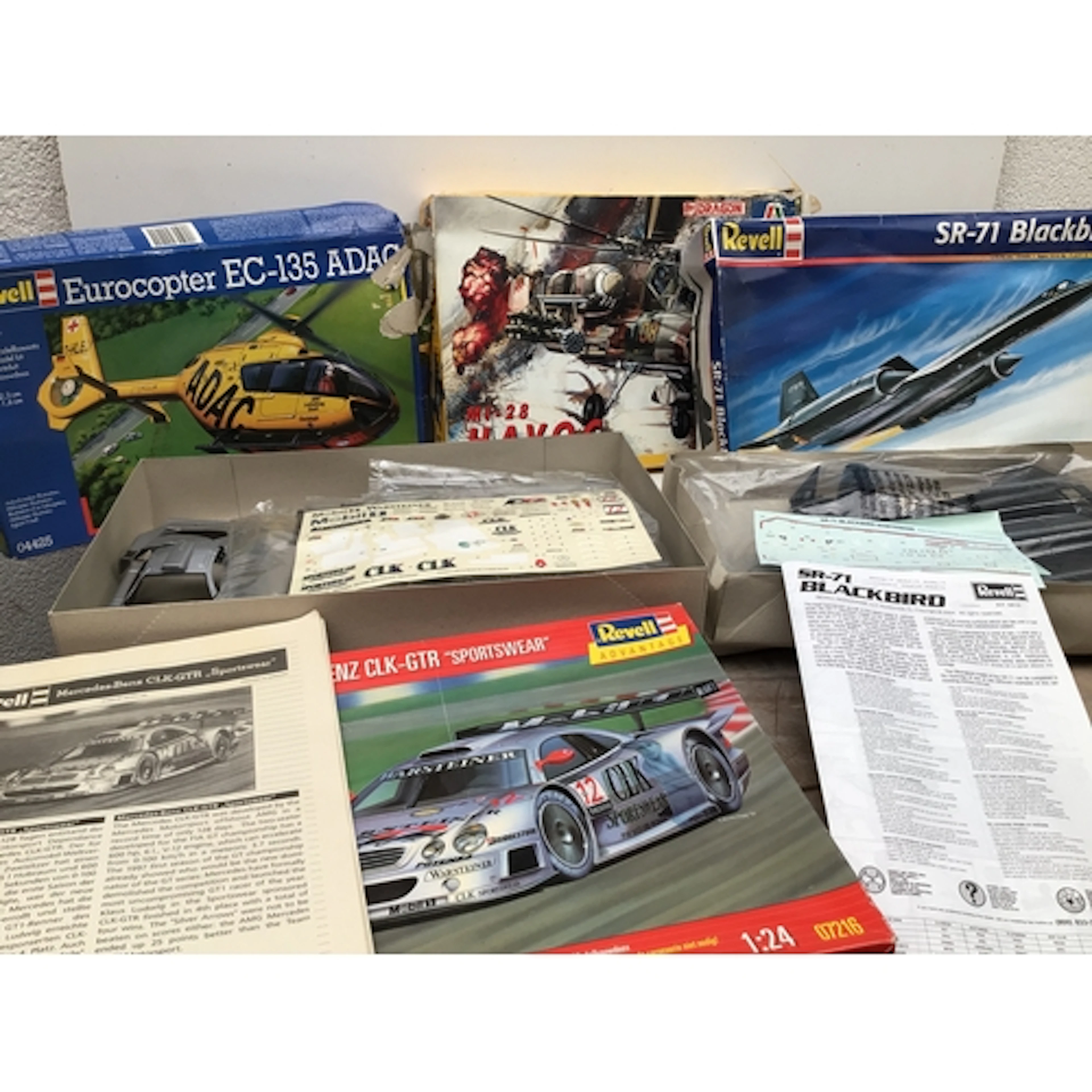A bag containing an assorted collection of model kits in var...