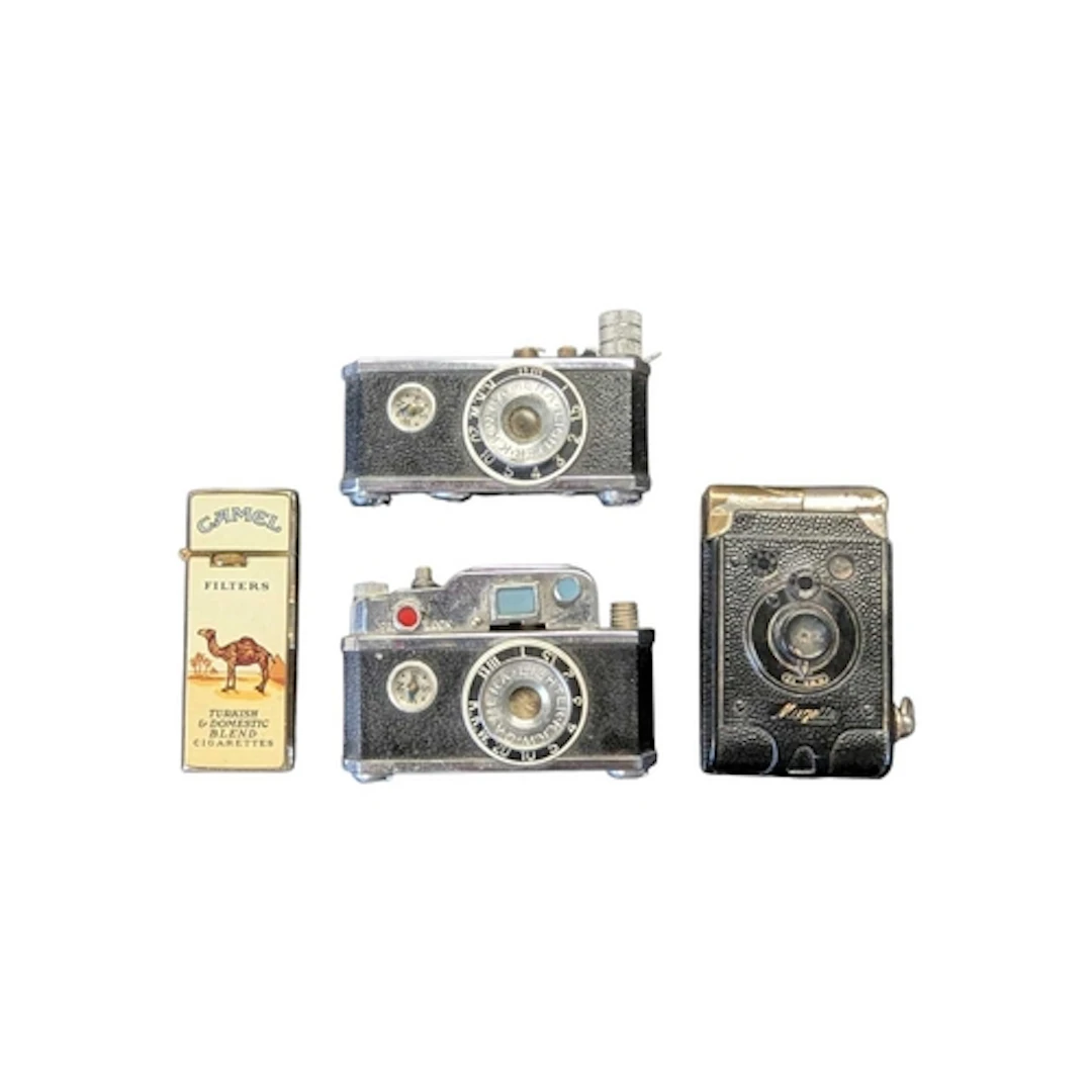 A collection of vintage 20th century novelty camera cigarett...