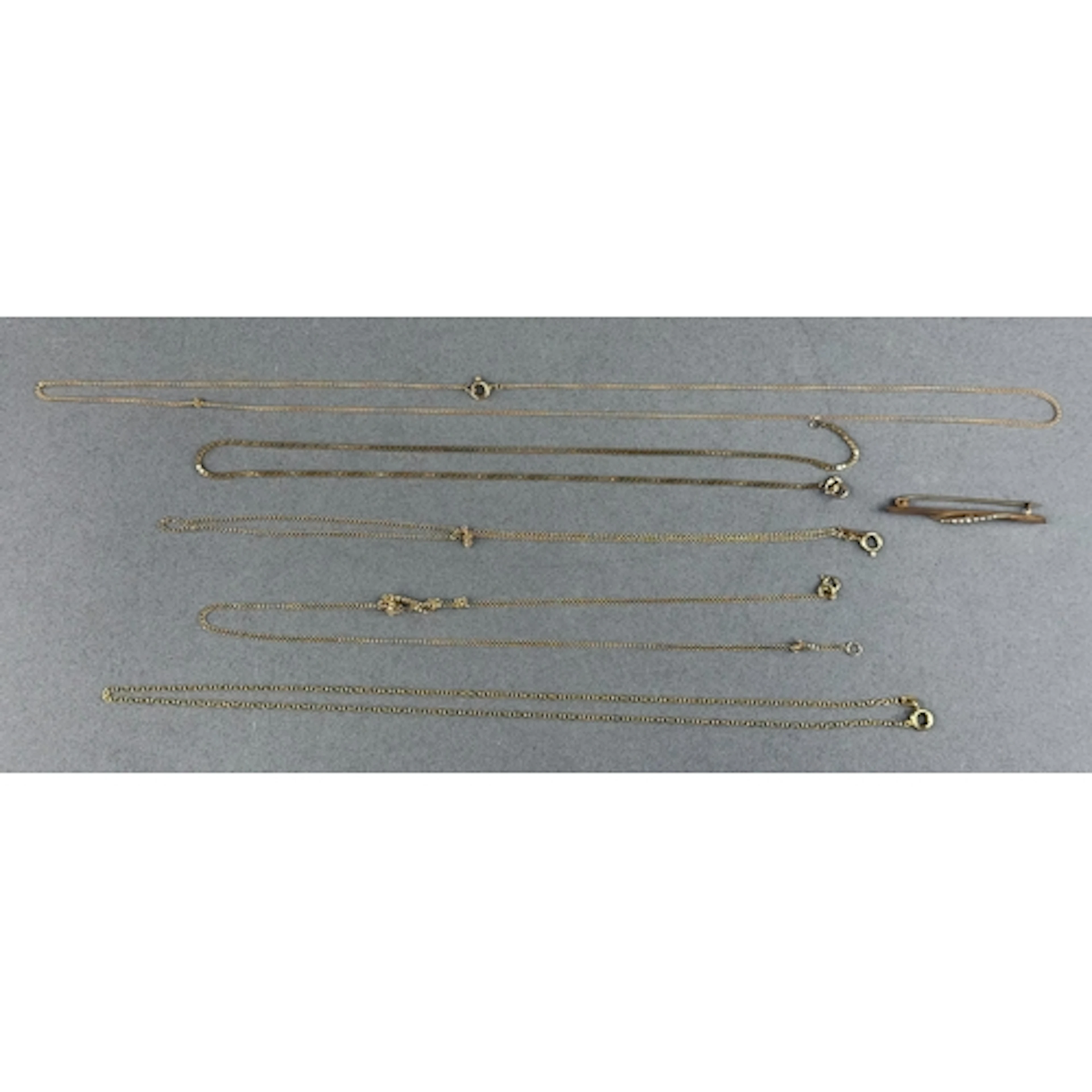 Jewellery: four 9ct yellow gold chains, various lengths and ...