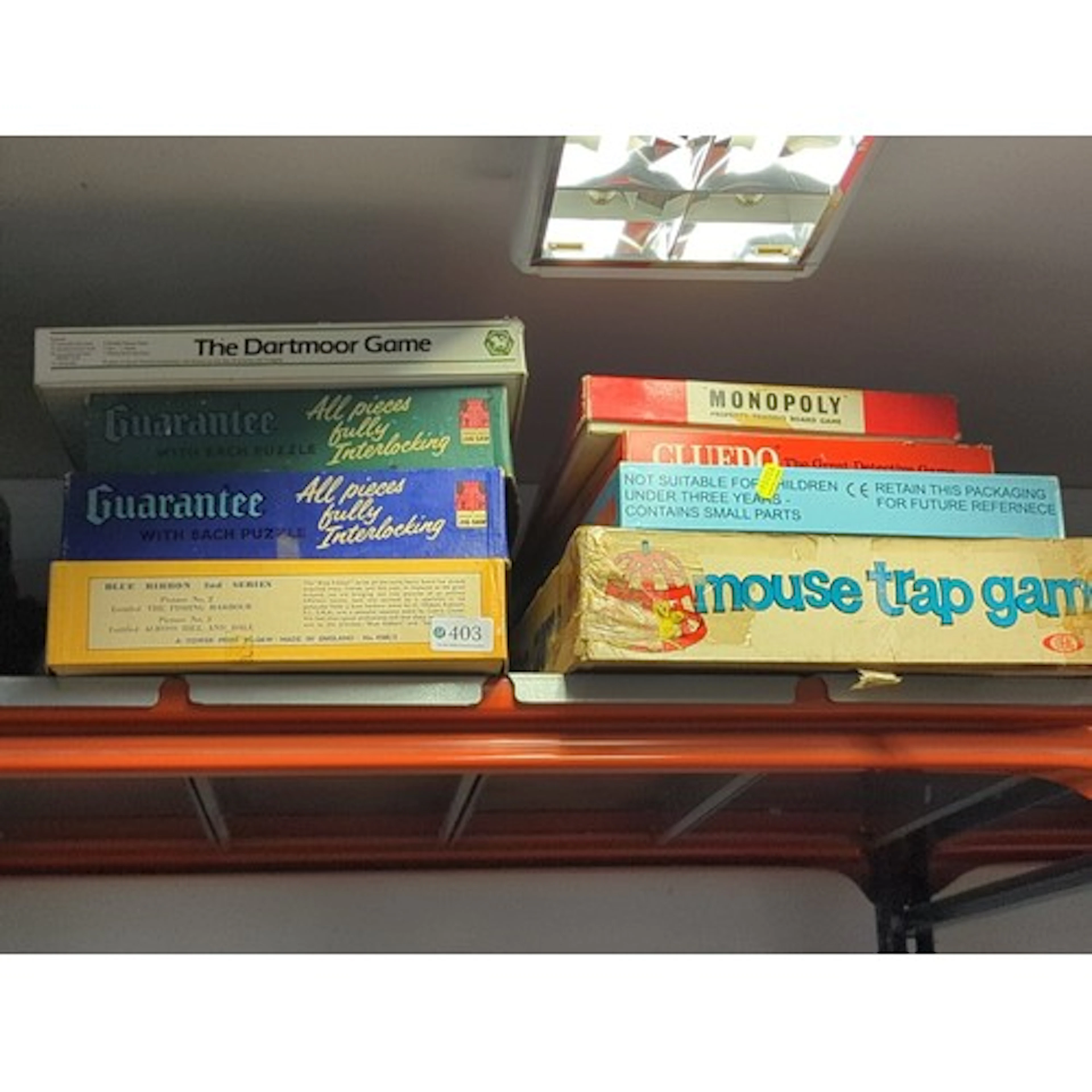 A group of boxed games and puzzles, including The Dartmoor G...