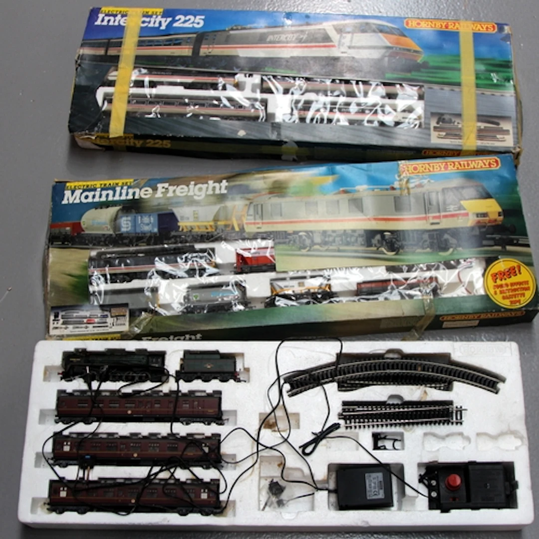 Three OO Gauge train sets, all part sets with loco's/carriag...