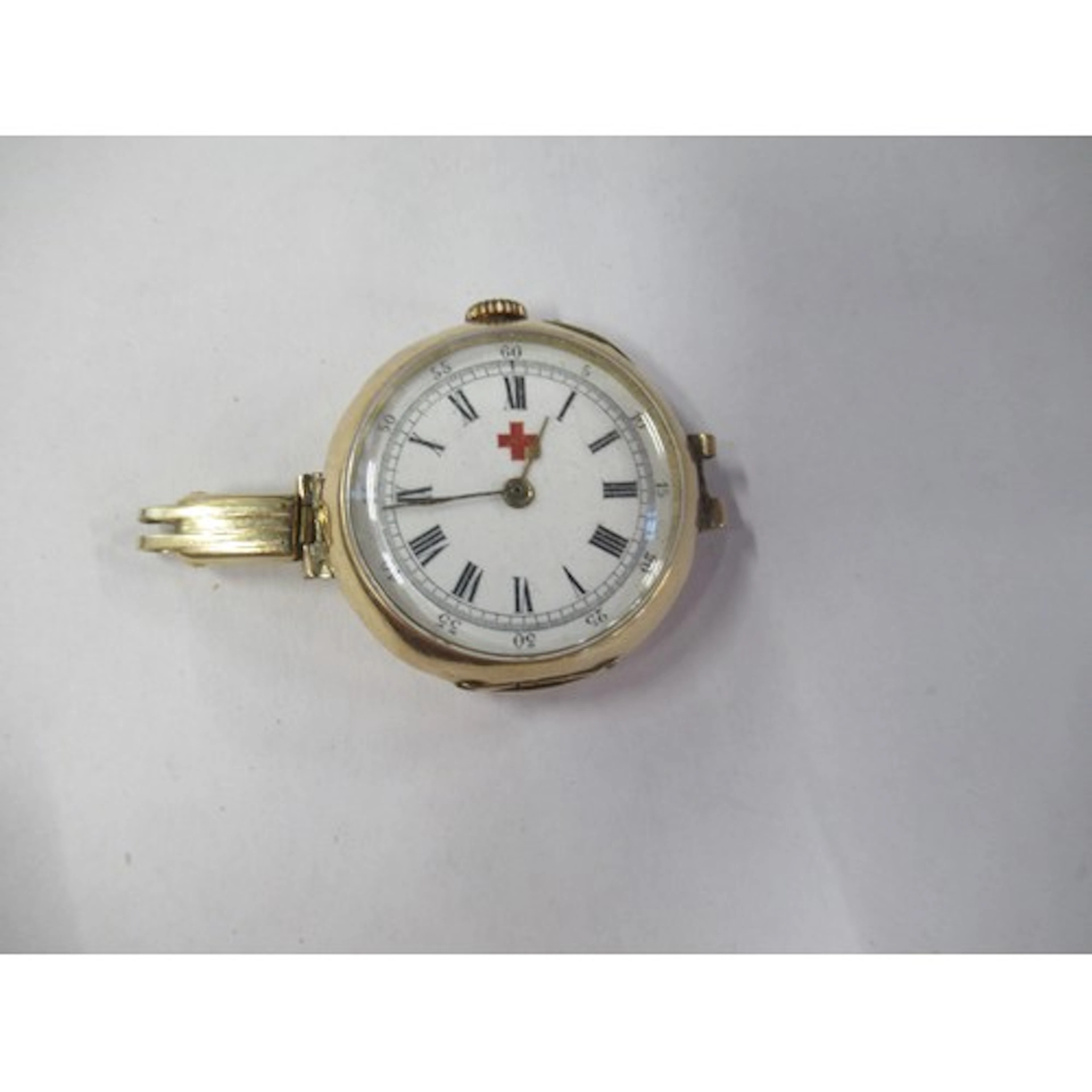 A 14k gold nurses watch, with red cross to the white enamel ...