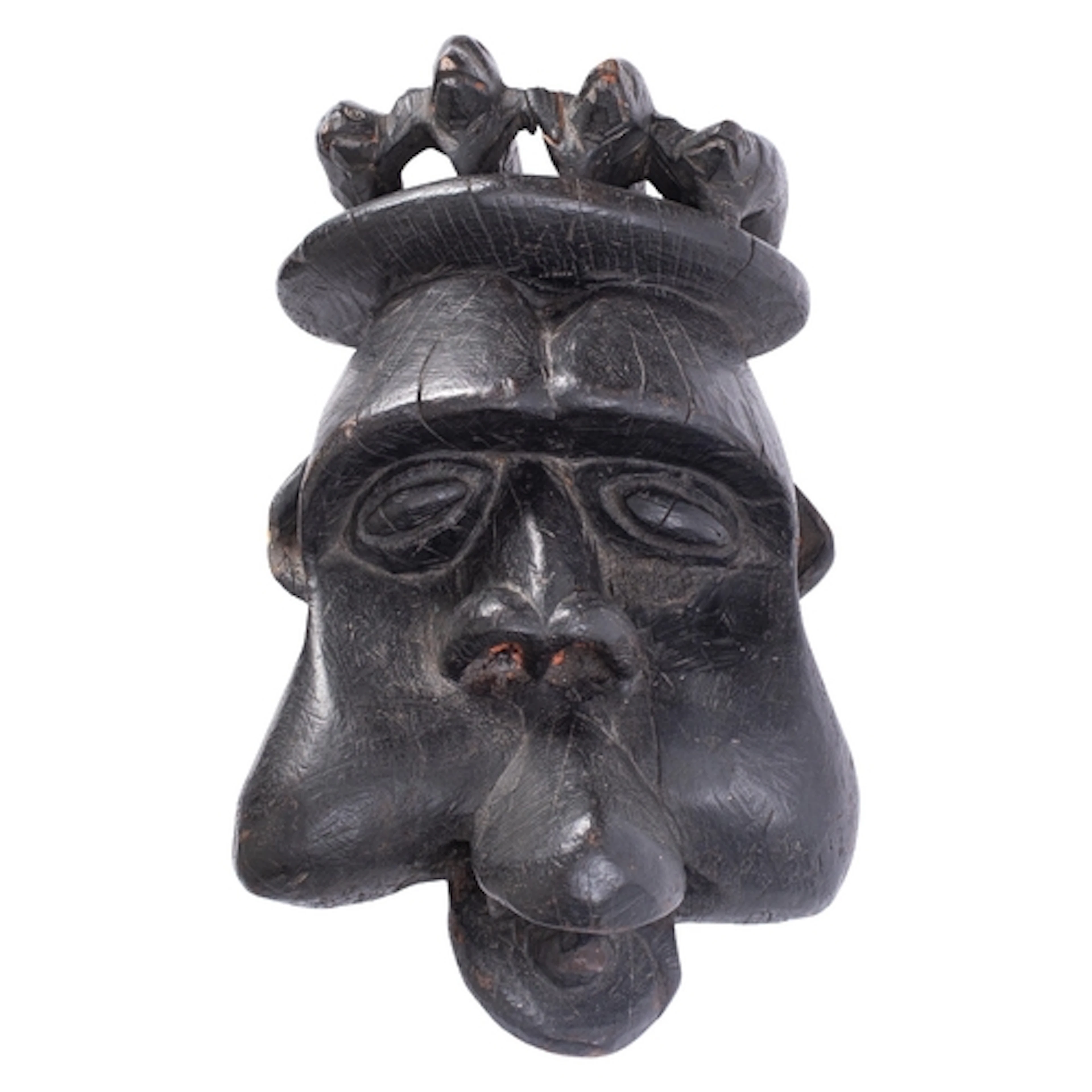 A large African carved and stained wood tribal mask, probabl...