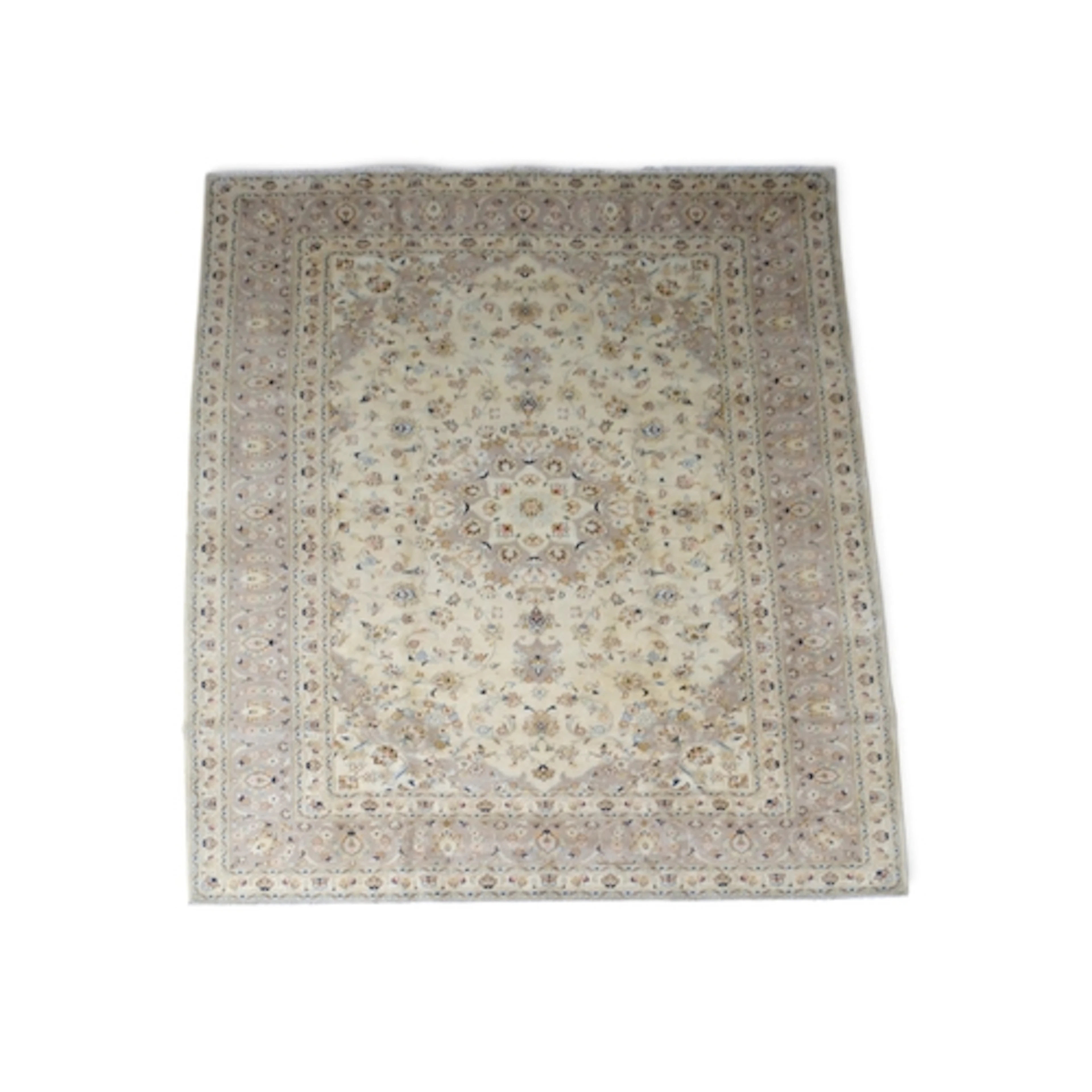 A CREAM GROUND FINE PILE KASHAN RUG with beige sunburst cent...