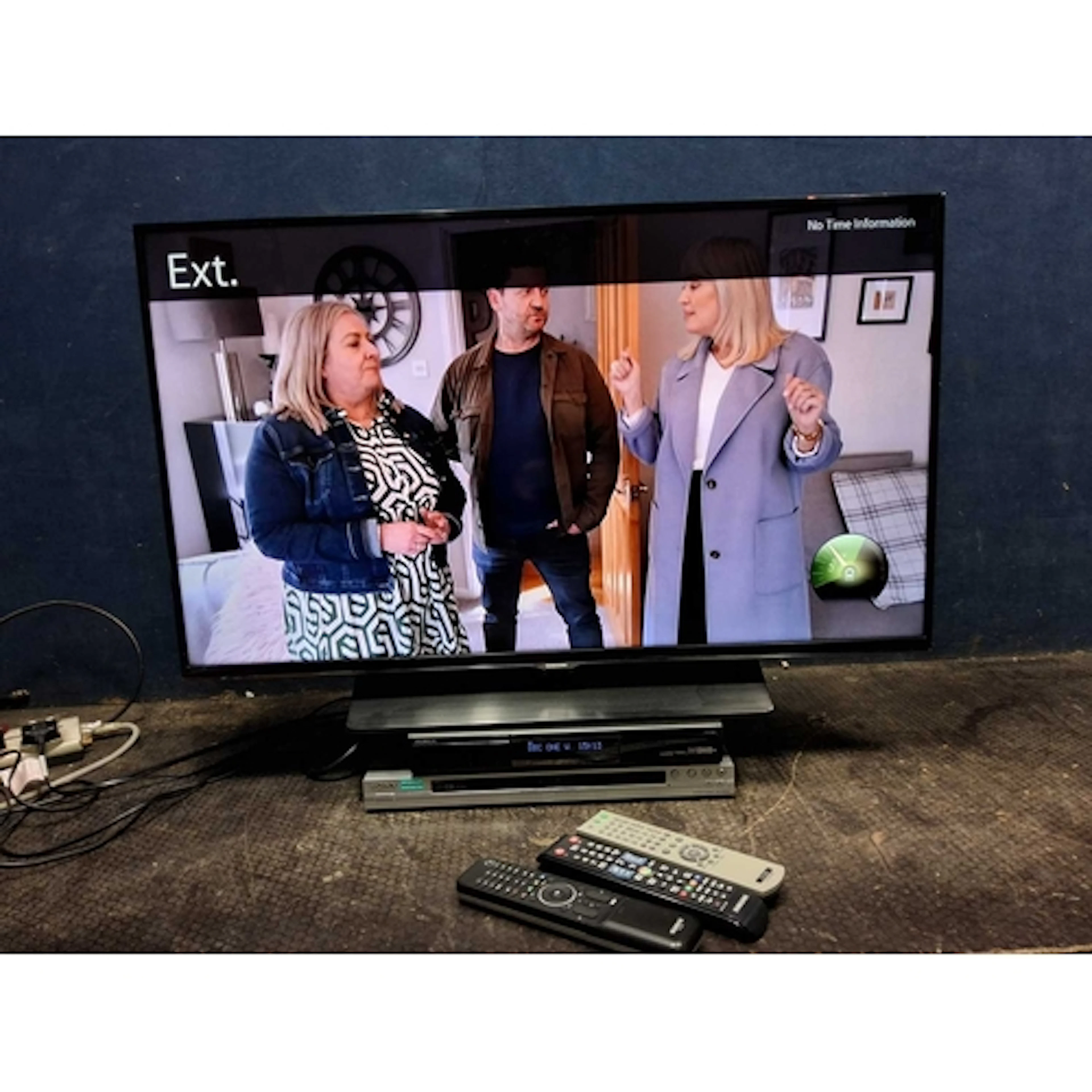 A SAMSUNG UE40H5500AK 40in SMART TV with remote, a Humax Fre...