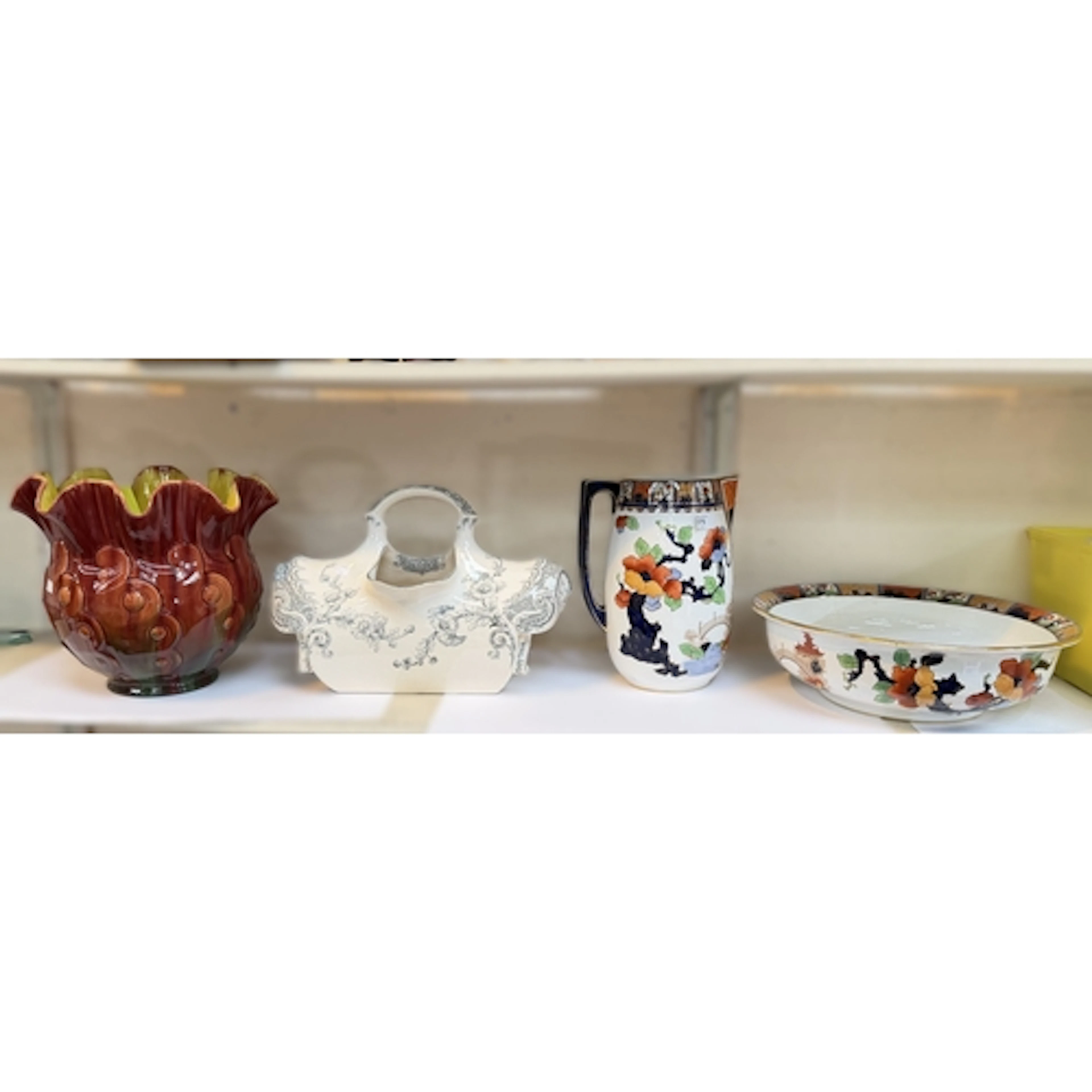 A ceramic washbowl and pitcher set with floral pattern, a Ro...