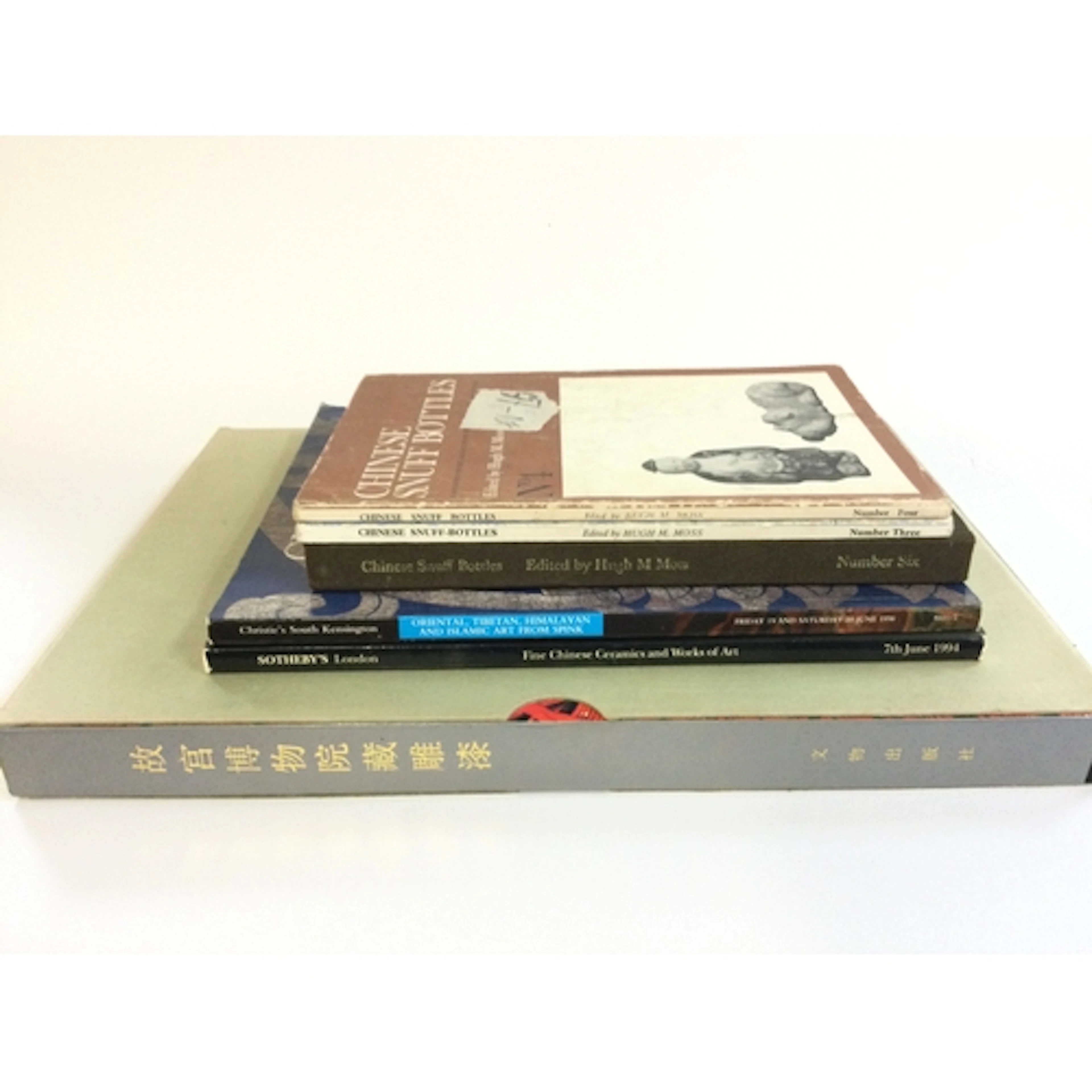 A box with Chinese Snuff Bottles books, Sotherbys and Christ...