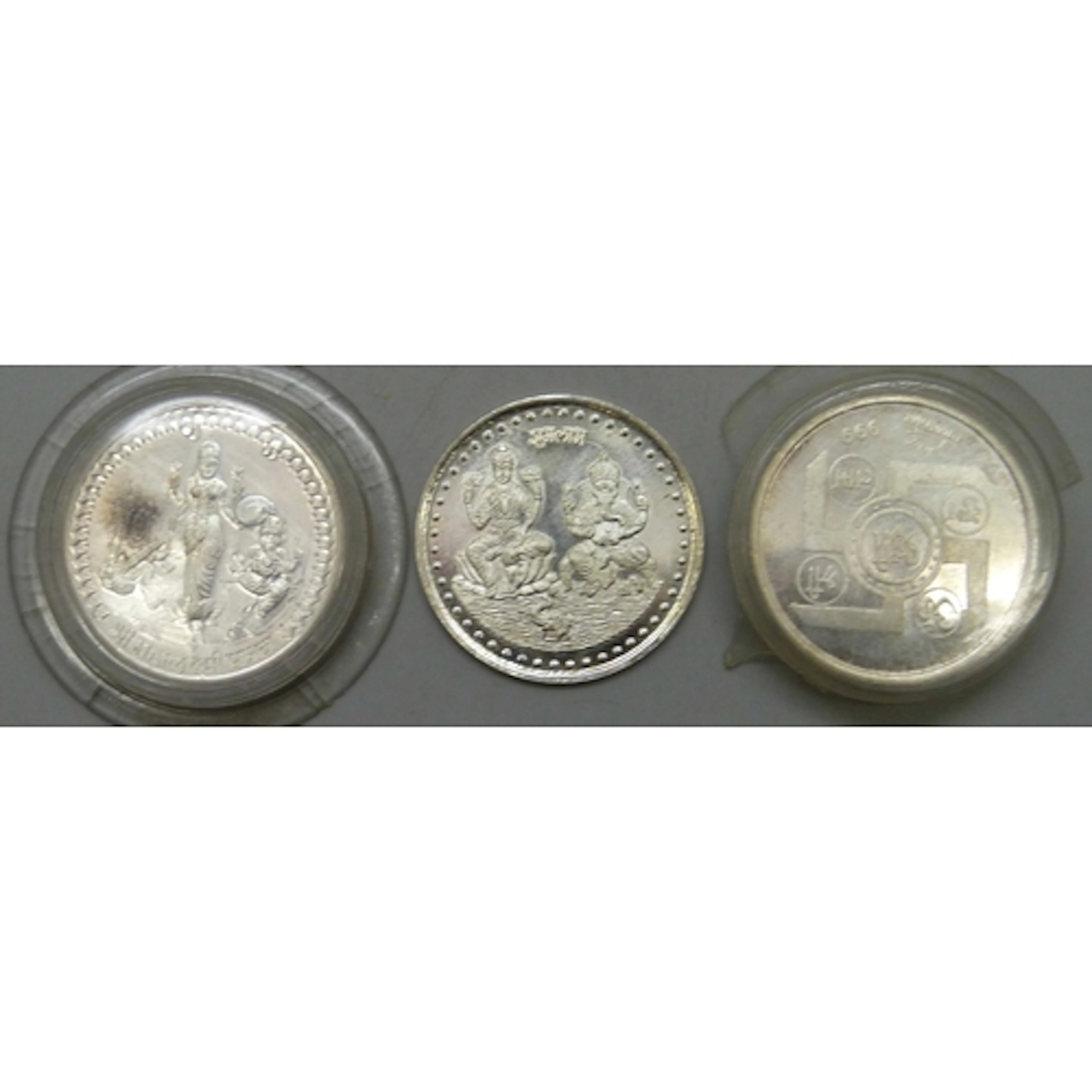 Three white metal Hindu coins/tokens, two marked .999