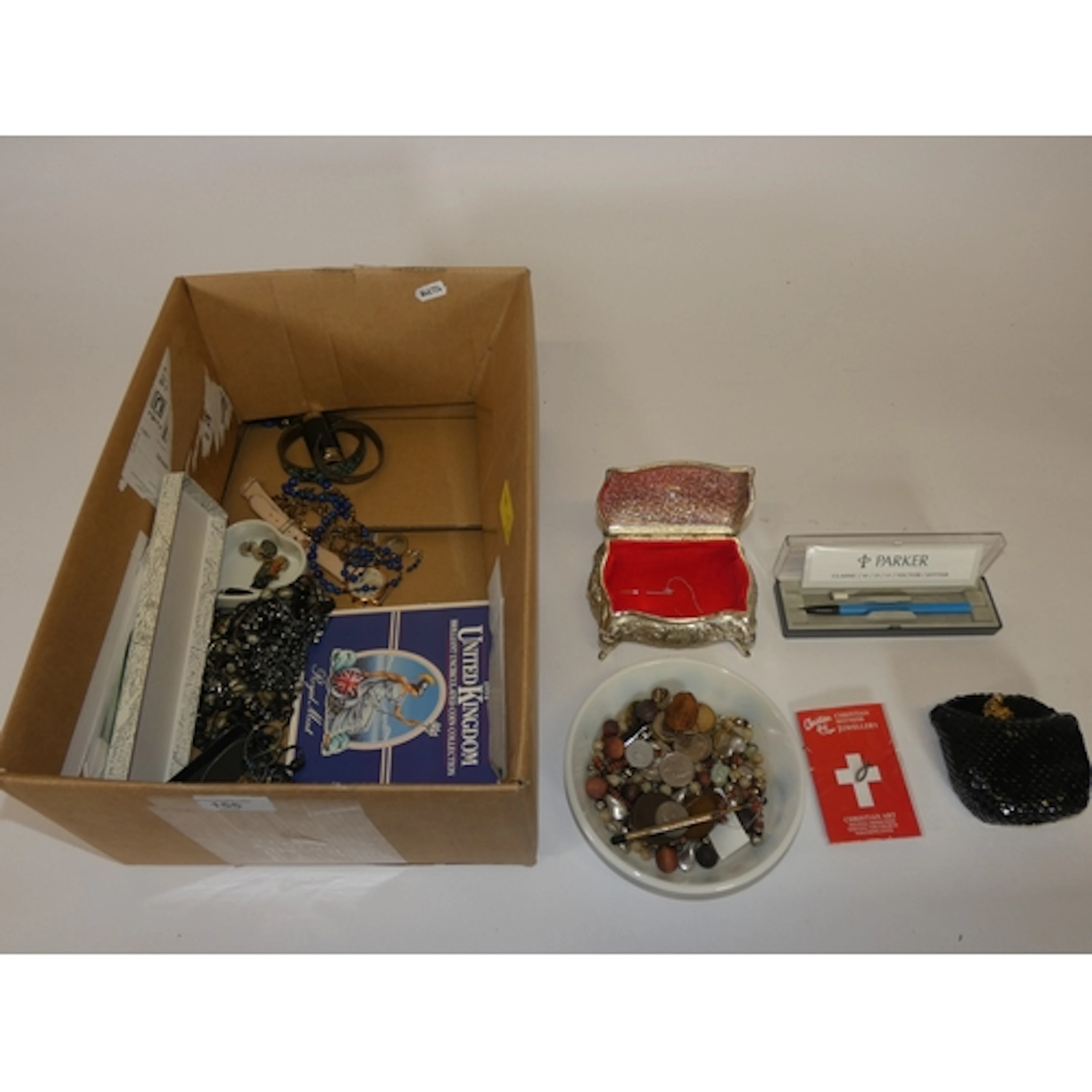Box of costume jewellery and curios to include a rubbed Geor...