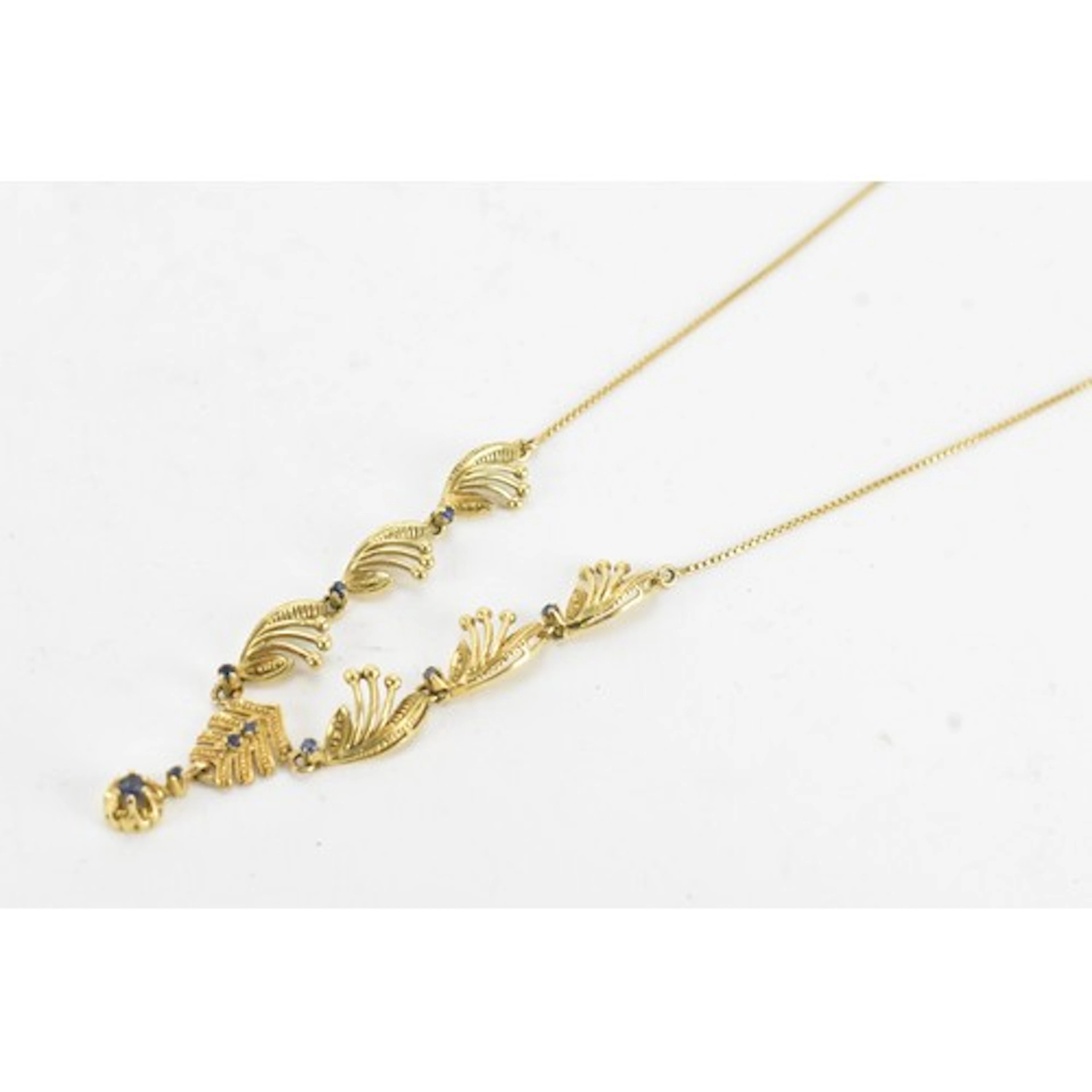 A 9ct gold and sapphire necklace, of articulated foliate des...