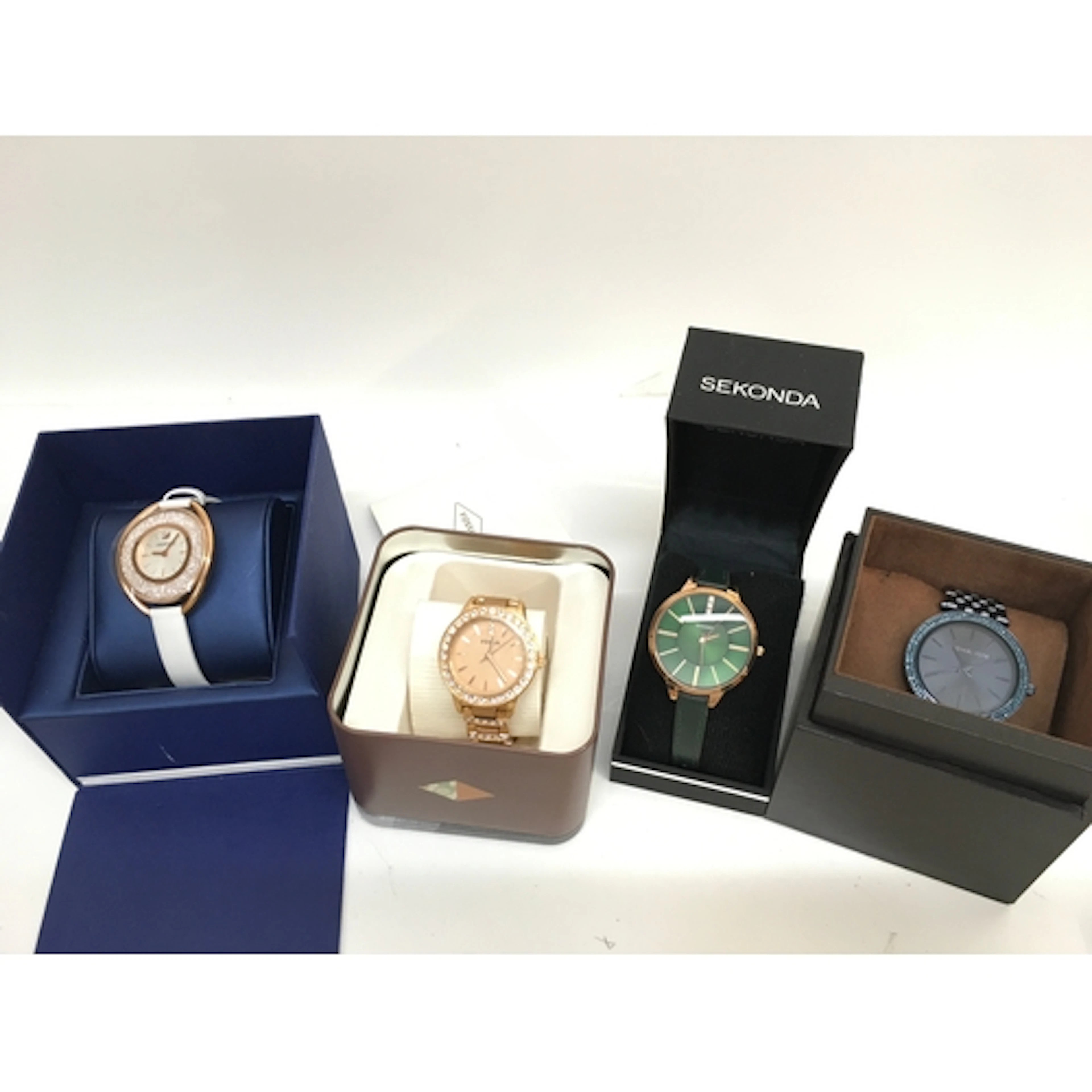 Four watches Swarovski, Fossil, Sekonda, Micheal Kors