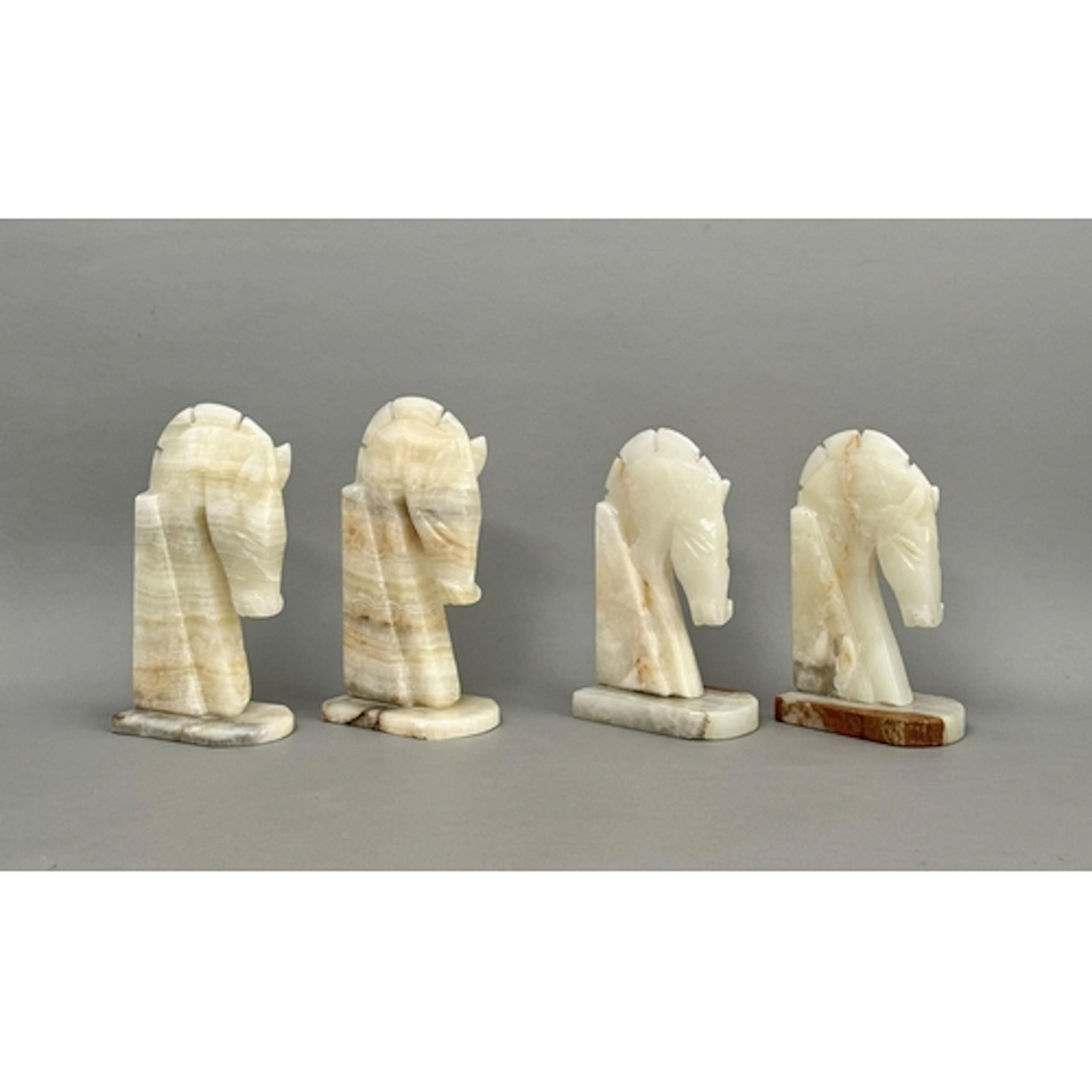 Two pairs of vintage carved onyx horse head bookends - one p...
