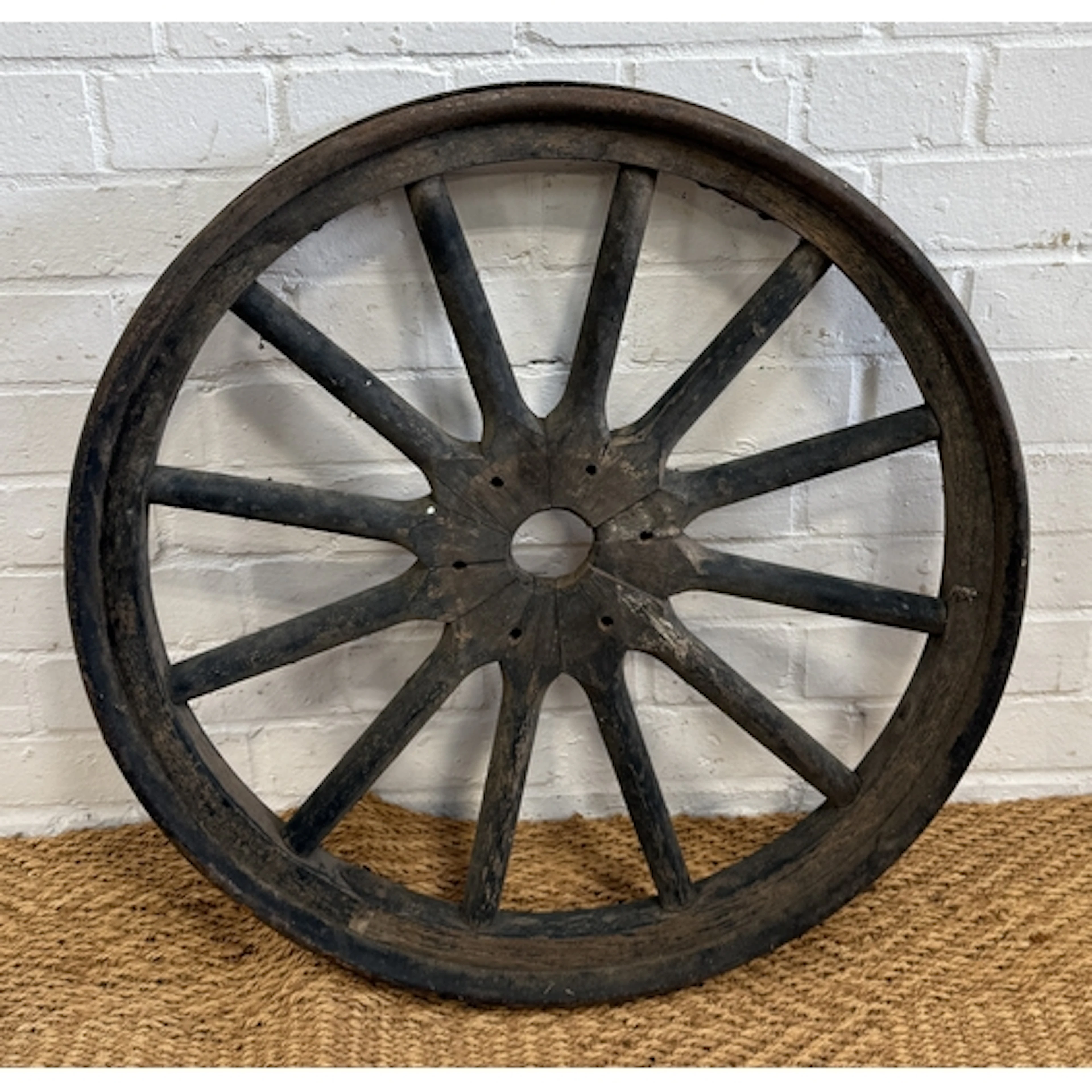 AN ANTIQUE WOODEN WHEEL 62cm W