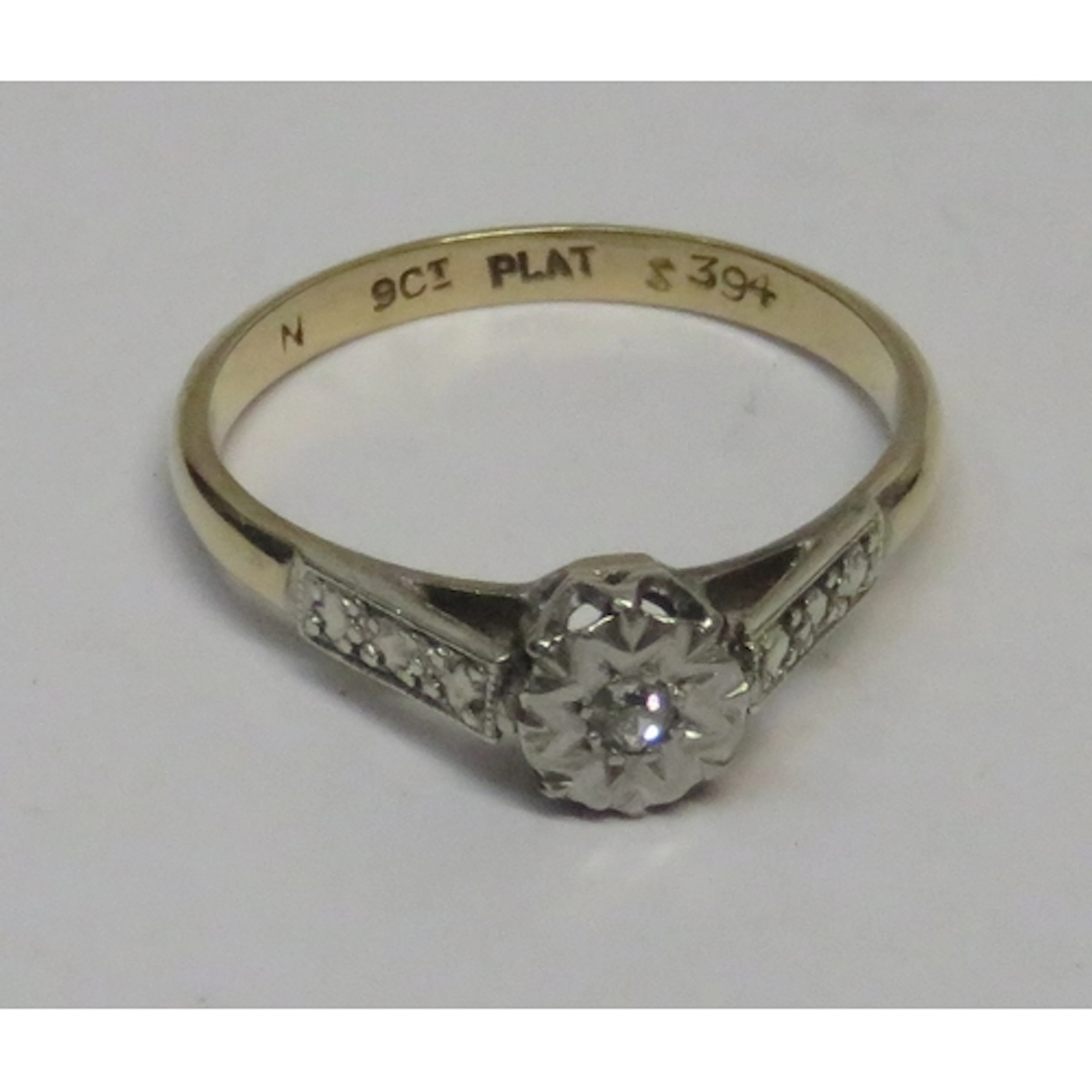9ct Gold and platinum diamond solitaire ring with diamond se...