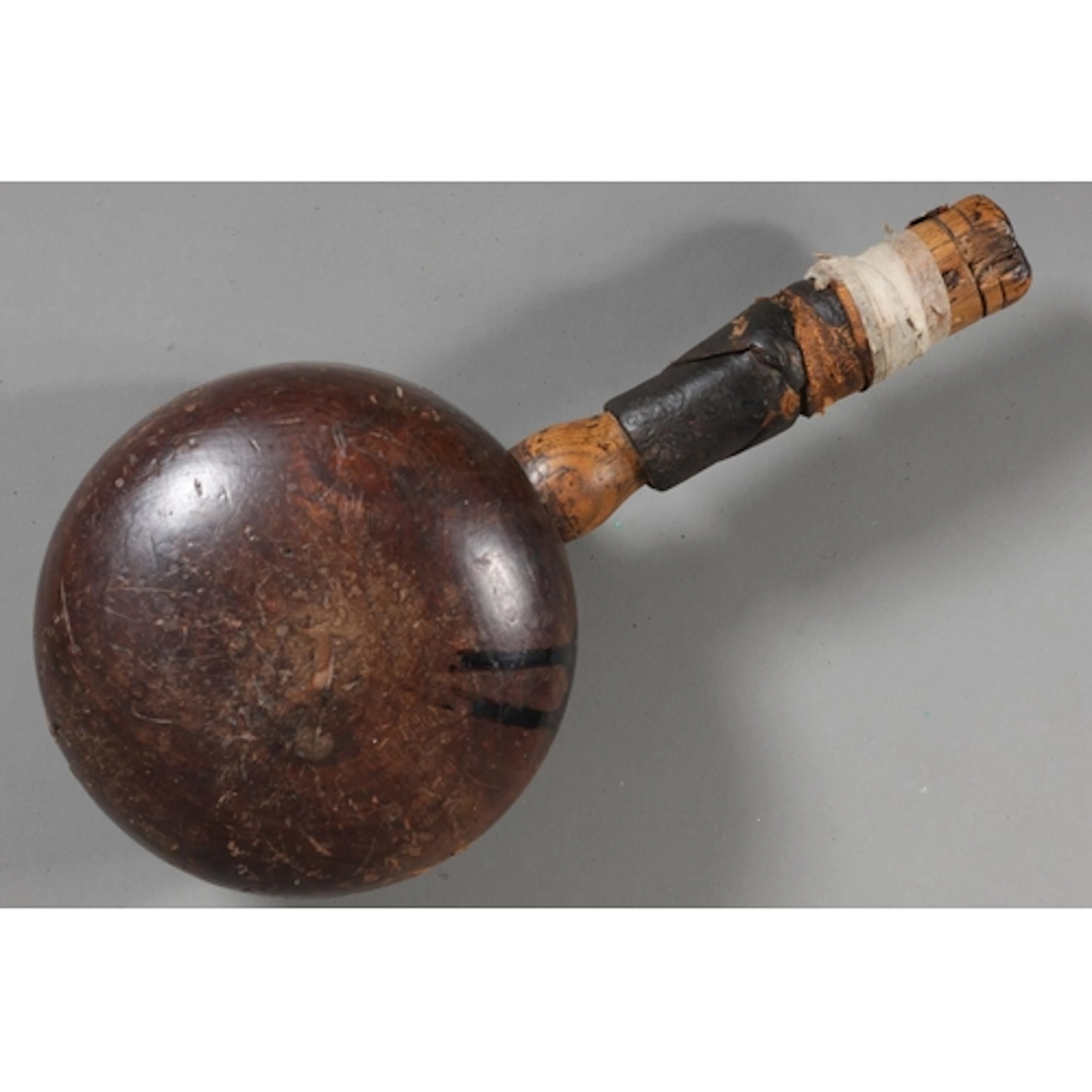 Rustic hardwood circular mallet.