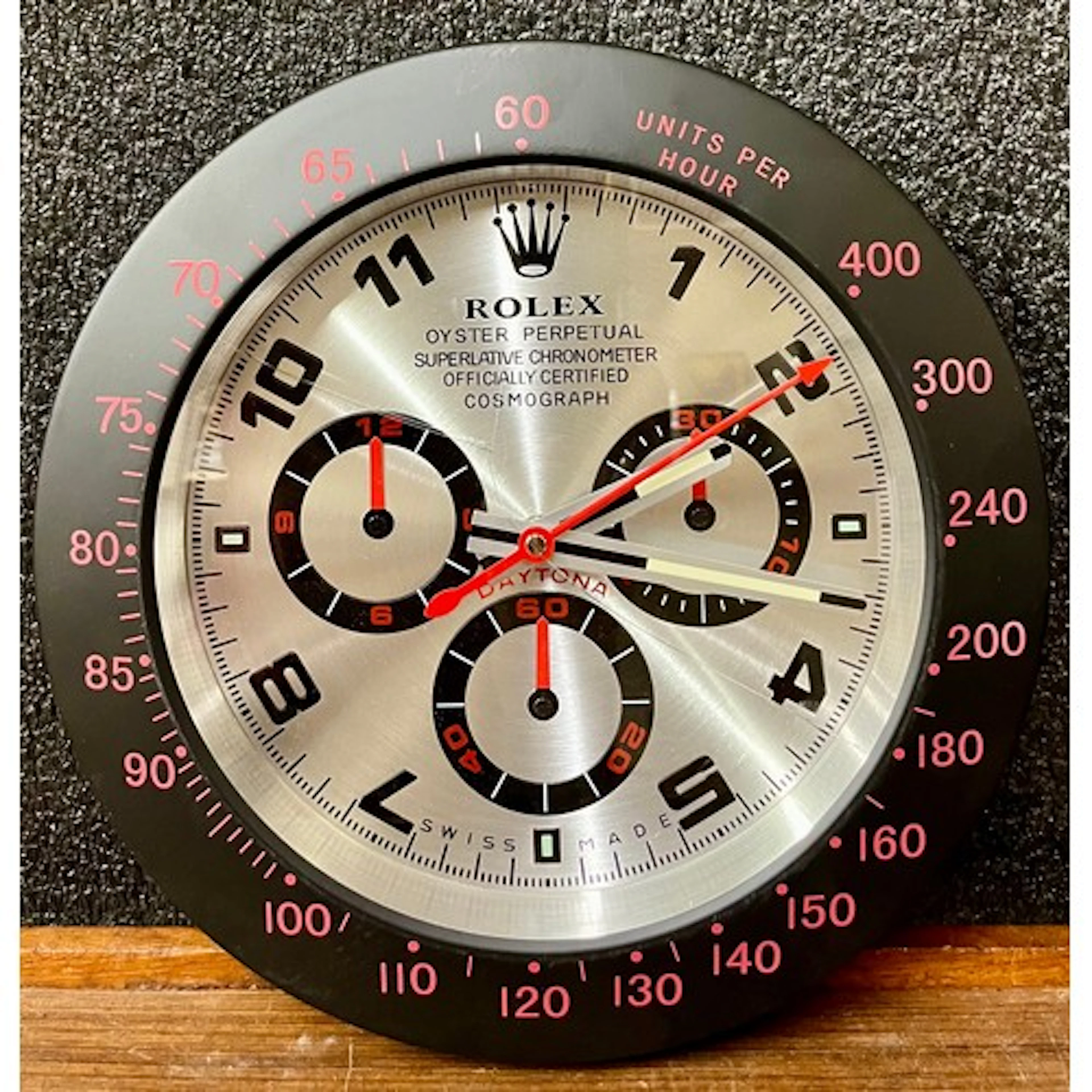 A Rolex style dealers display wall clock