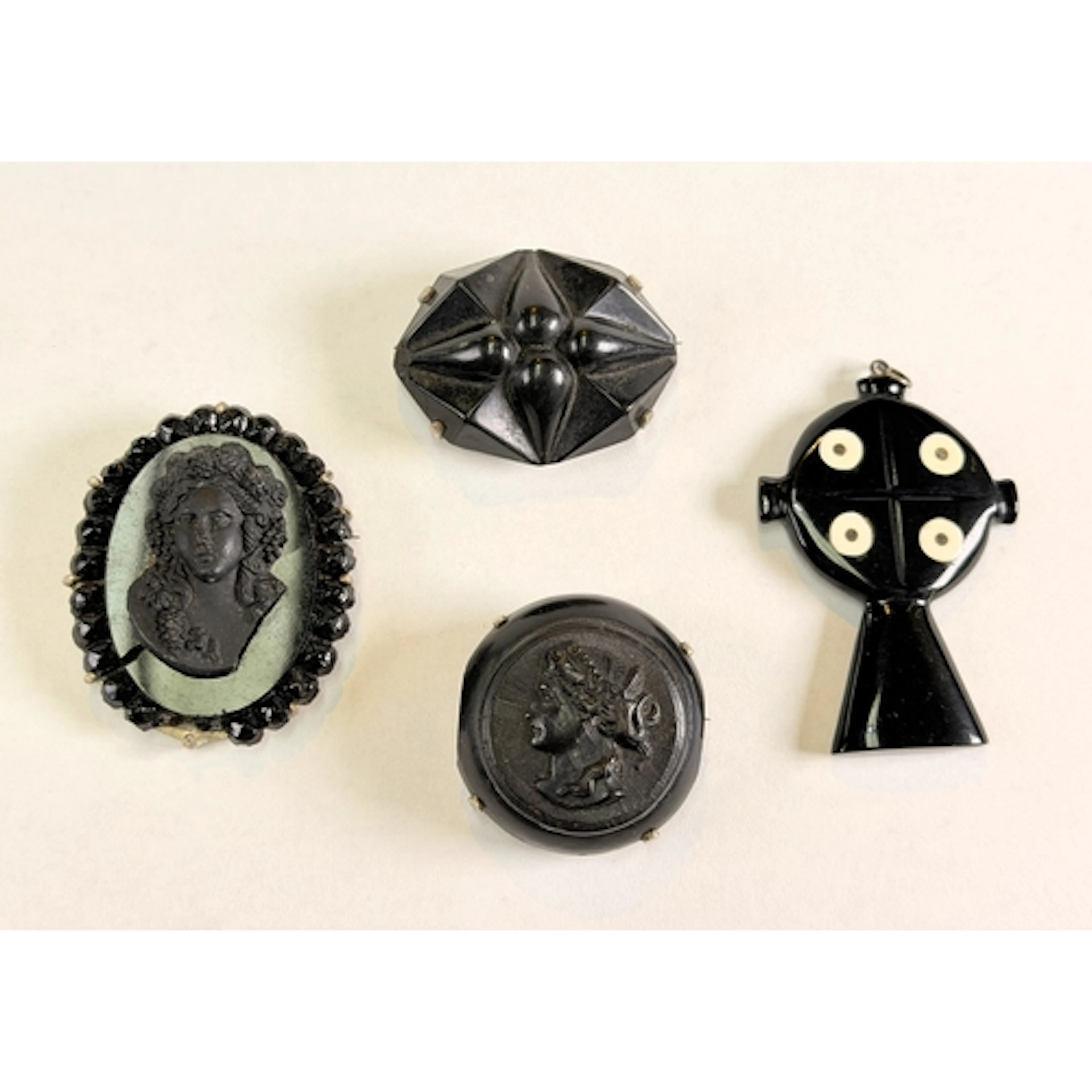 An antique mourning brooch in white metal surround stamped S...