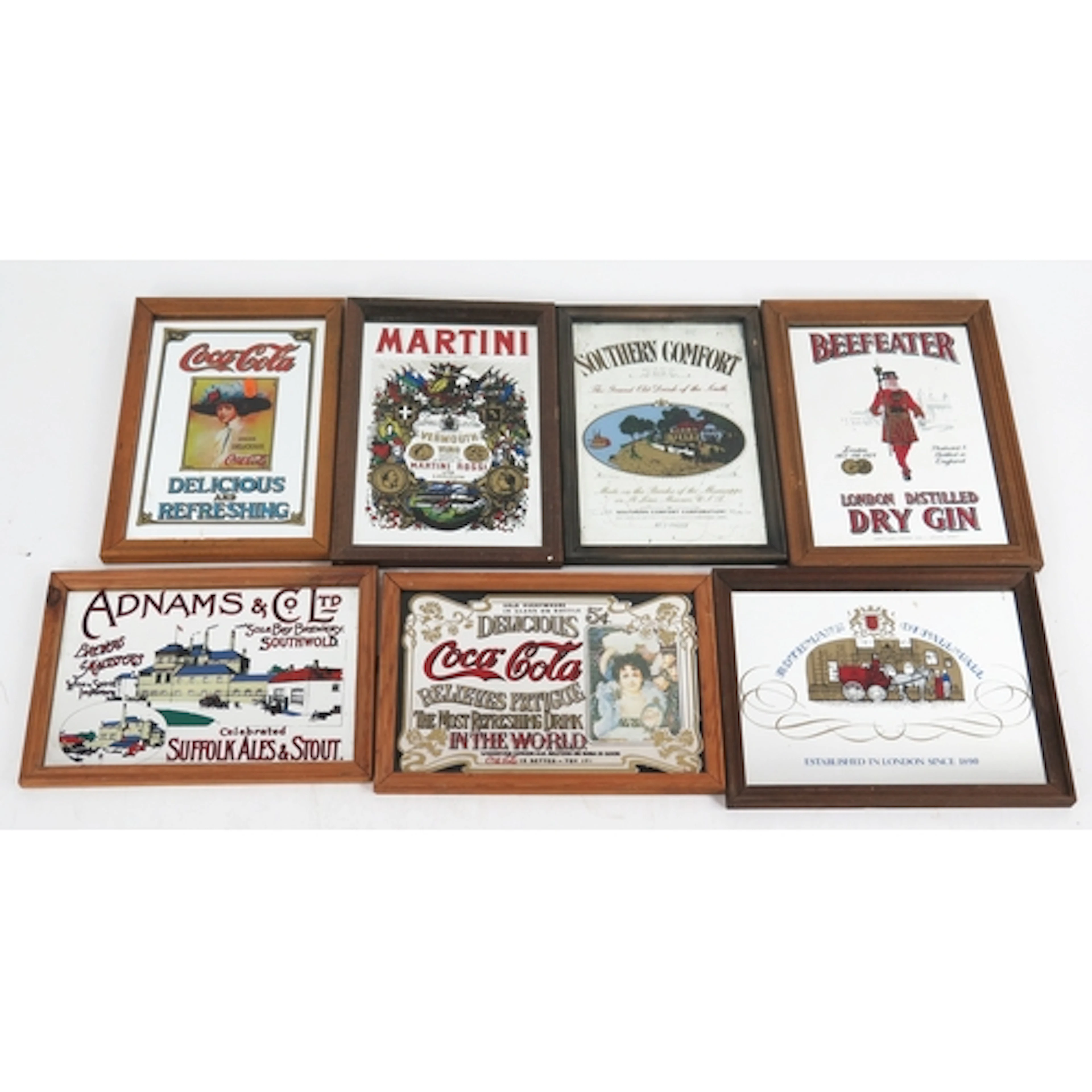 Seven various reproduction advertising mirrors including Coc...