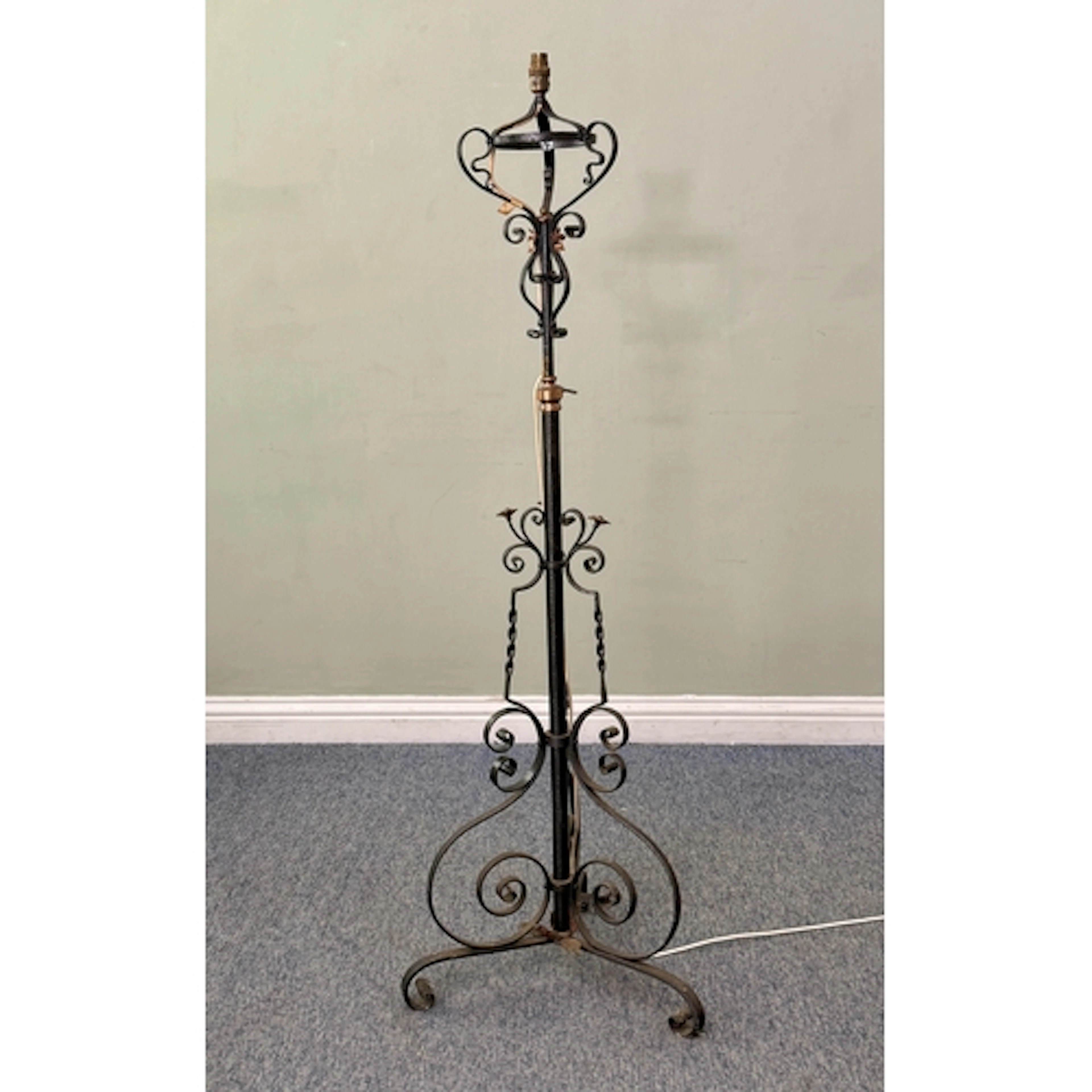An early 20th century black painted and copper standard lamp...