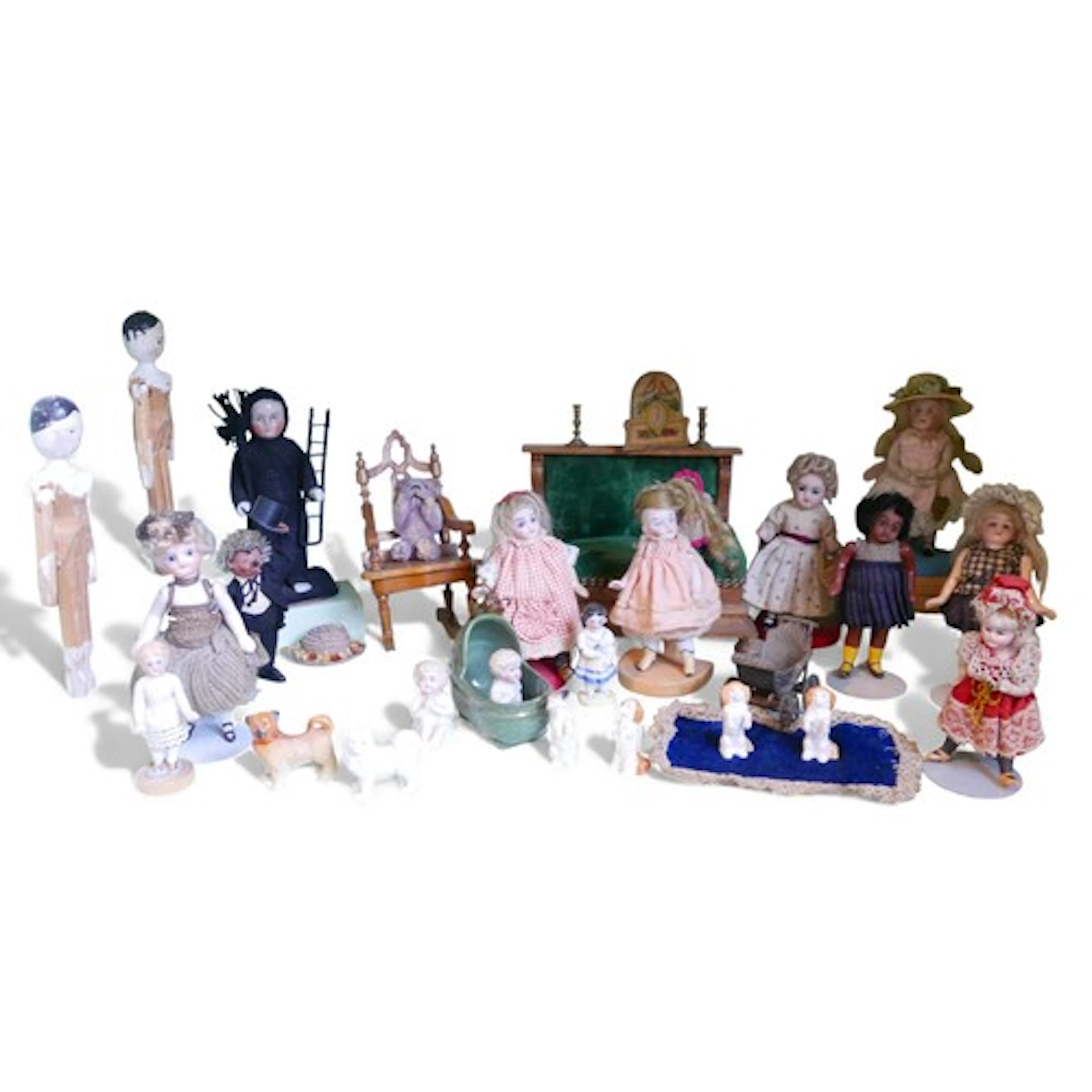 A group of doll's house furniture and dolls, including an up...