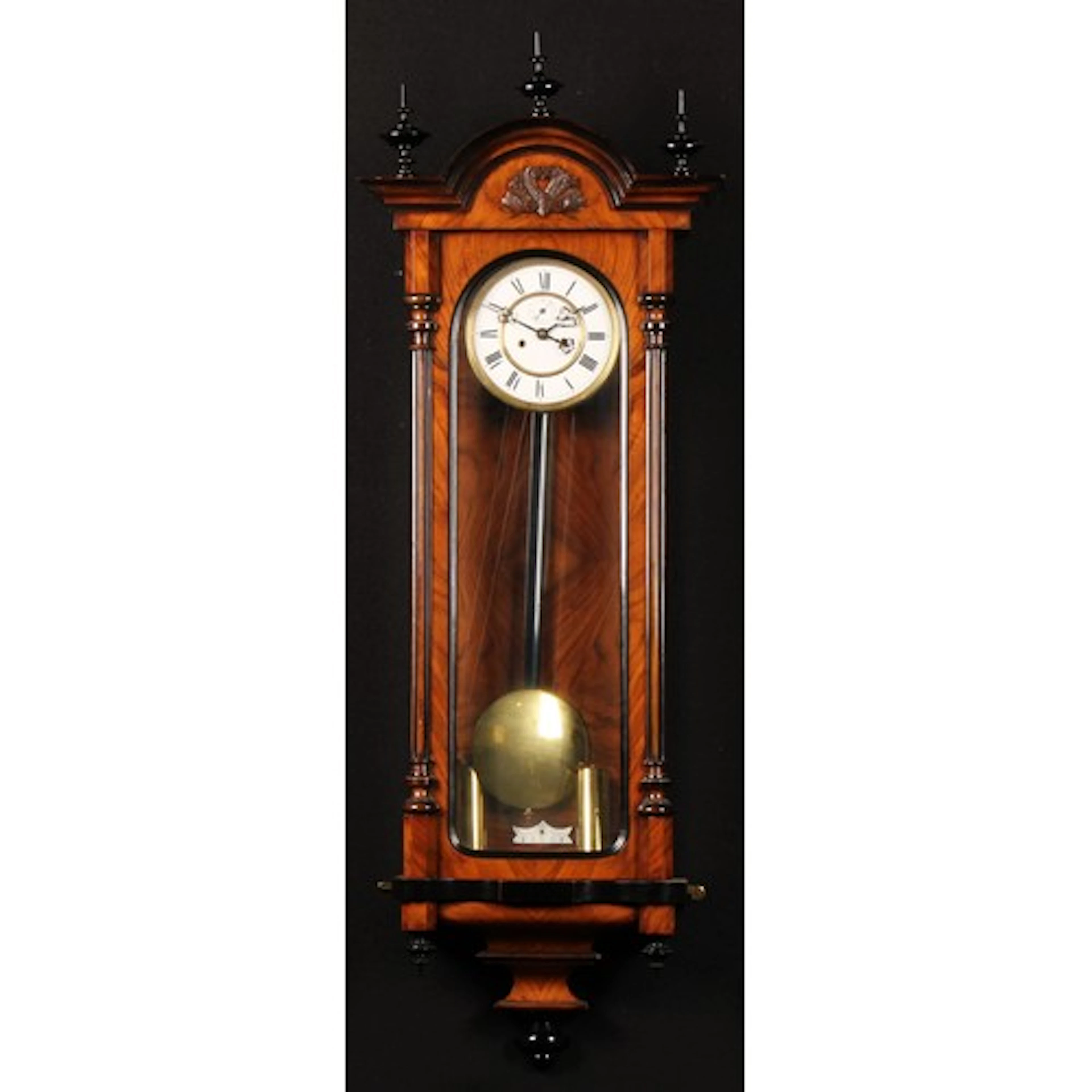 A late 19th century walnut and ebonised twin weight Vienna w...