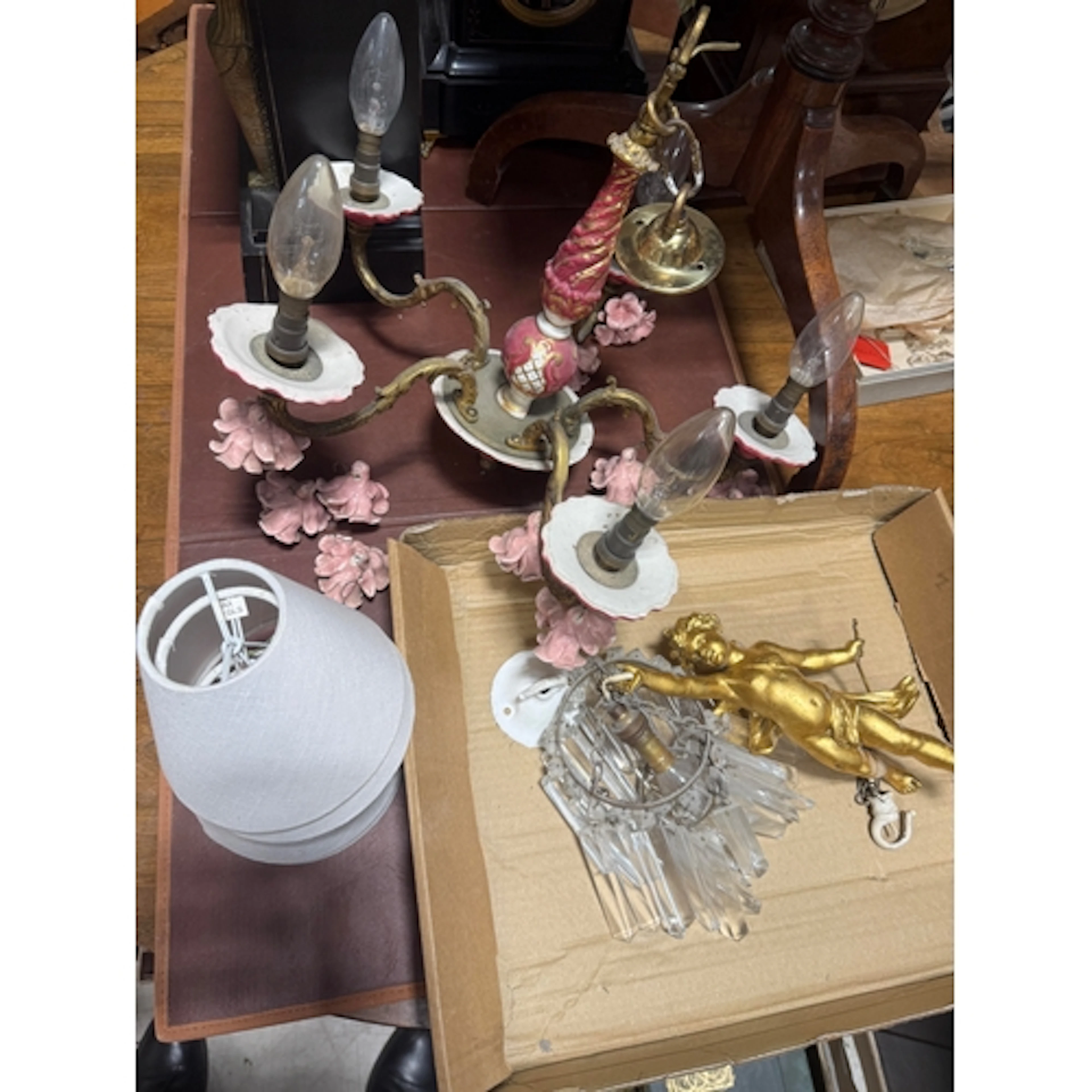 A TWO-TIER CIRCLET PENDANT LIGHT FITTING HUNG FROM A GILT CH...