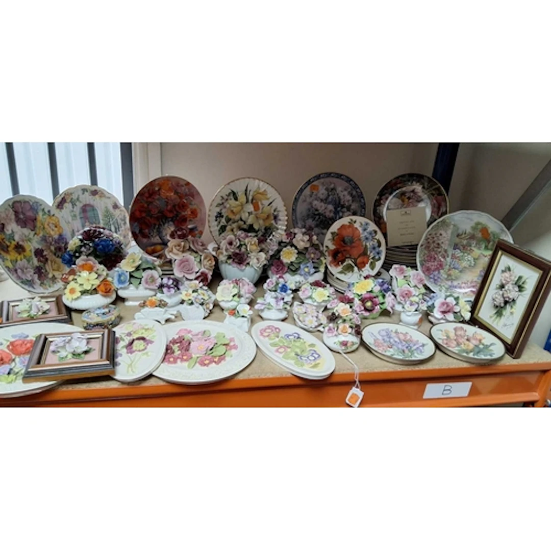 A GROUP OF FLORAL ORNAMENTS AND PLATES, ETC, to include mode...