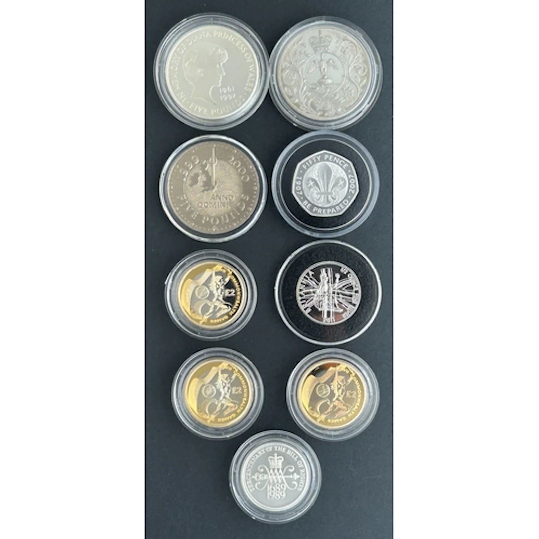 A group of nine UK silver coins, comprising 2007 silver 50p,...