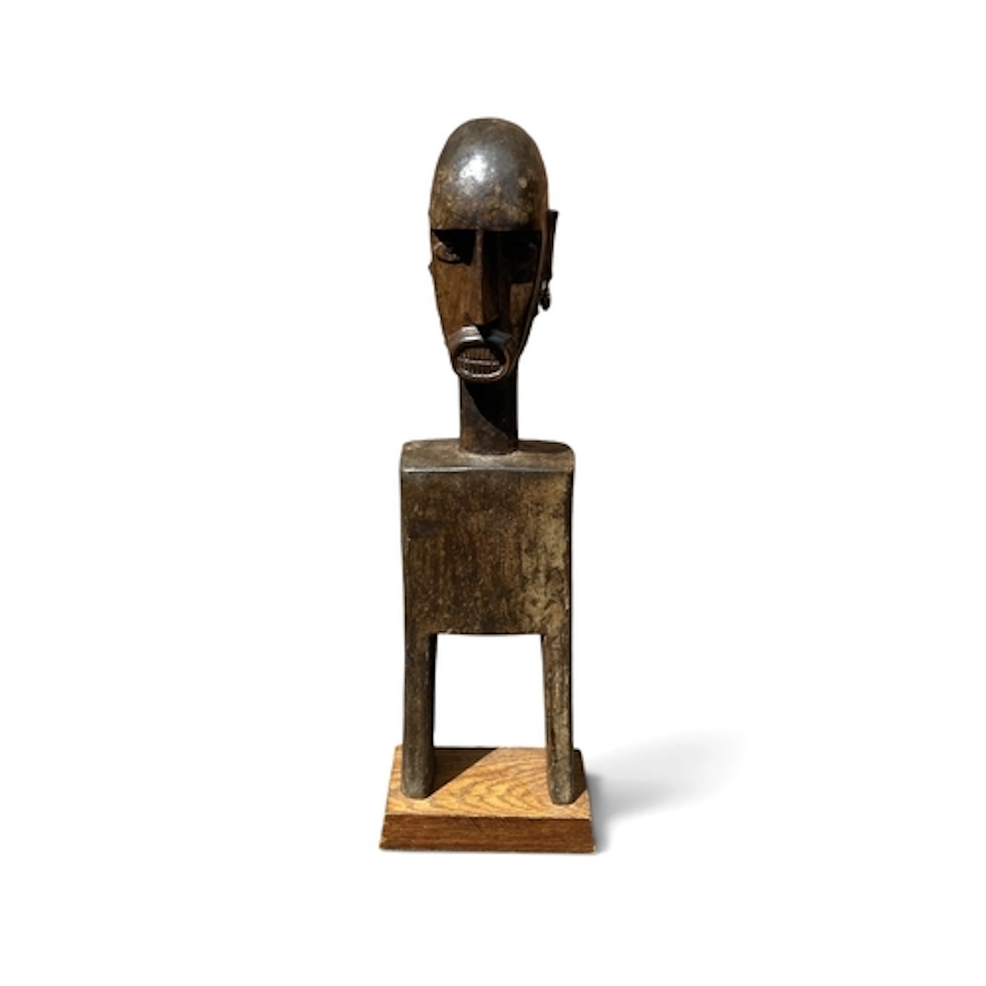 A LARGE AFRICAN BAULE TRIBE FIGURE WITH COWRIE SHELL EARRING...