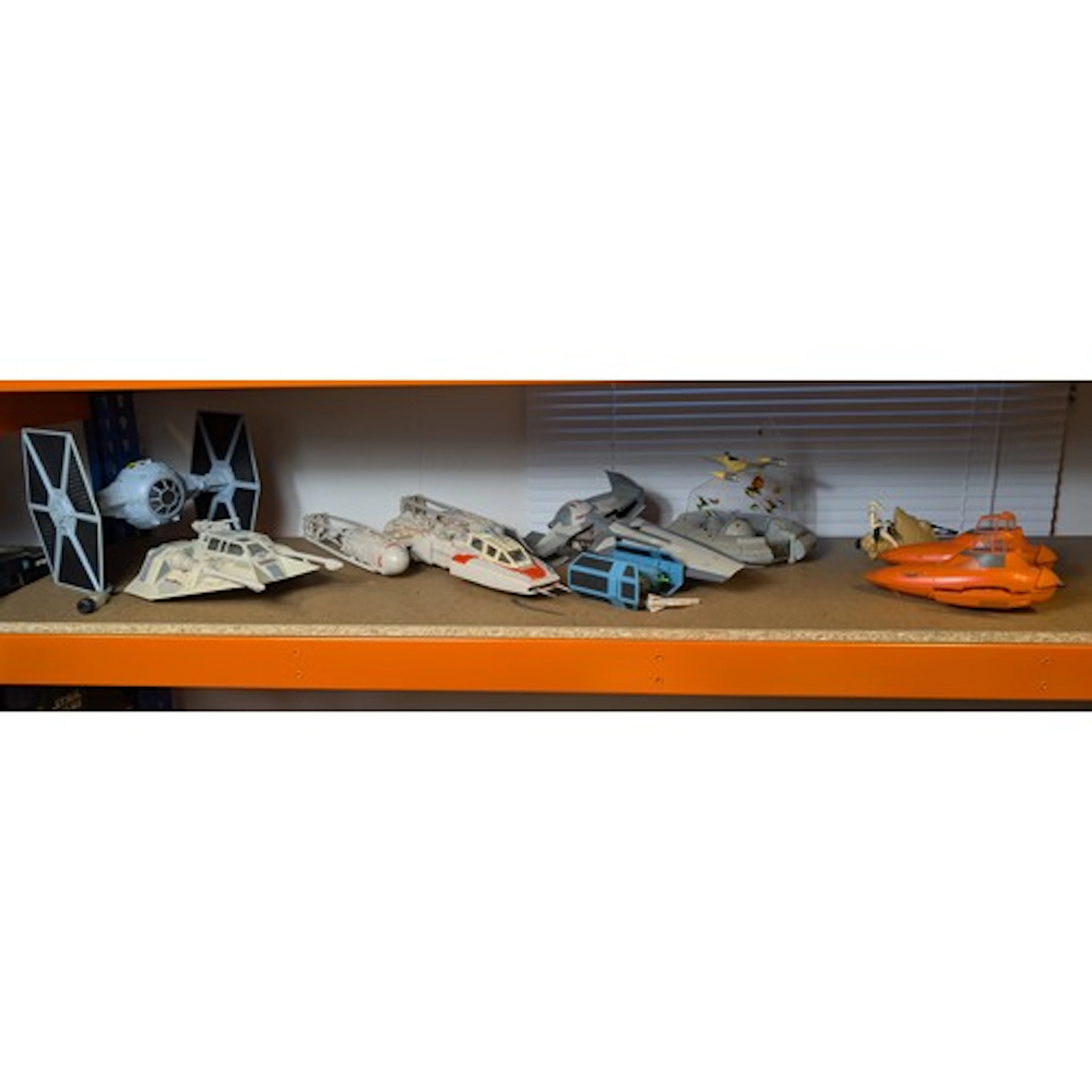 Shelf of various Star Wars vehicles inc. Darth Maul's Sith I...