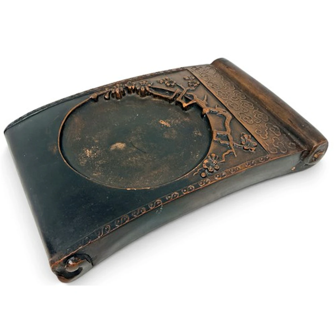 A Chinese scholar’s carved ink stone, of scrolled rectangula...