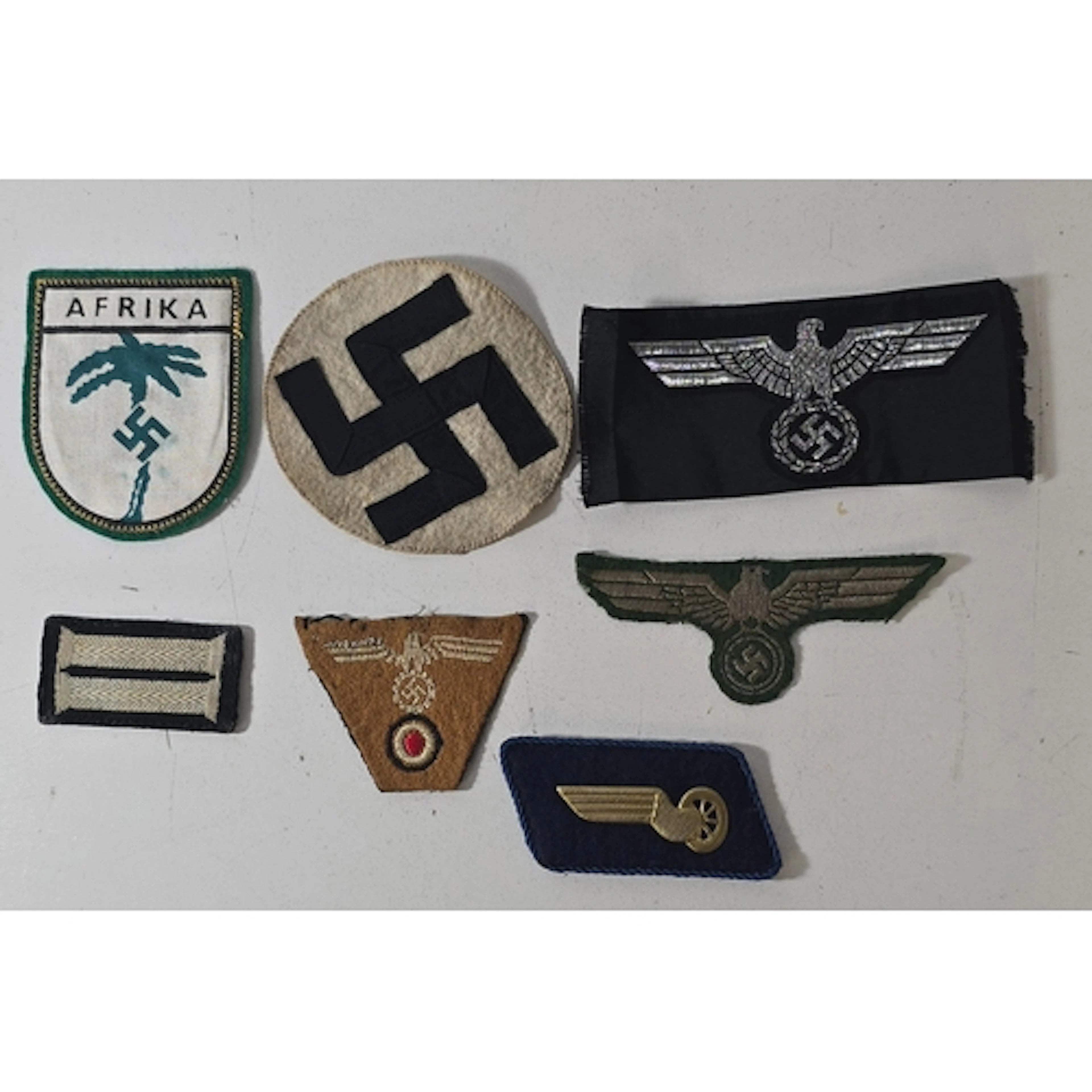 7 WWII German cloth insignia: Afrika Corps shield, two eagle...