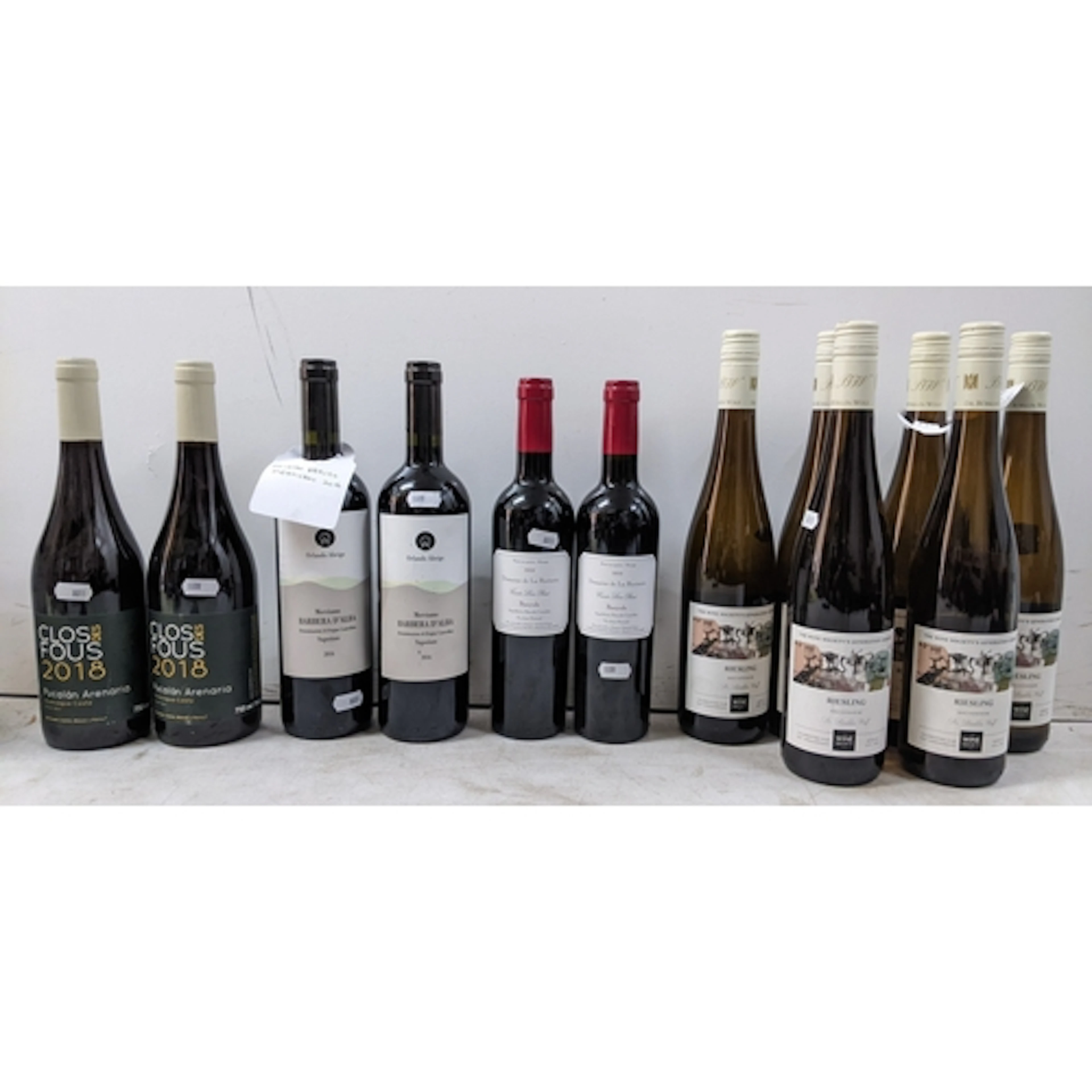 A mixed group of twelve bottles of wine, comprising: - Six b...