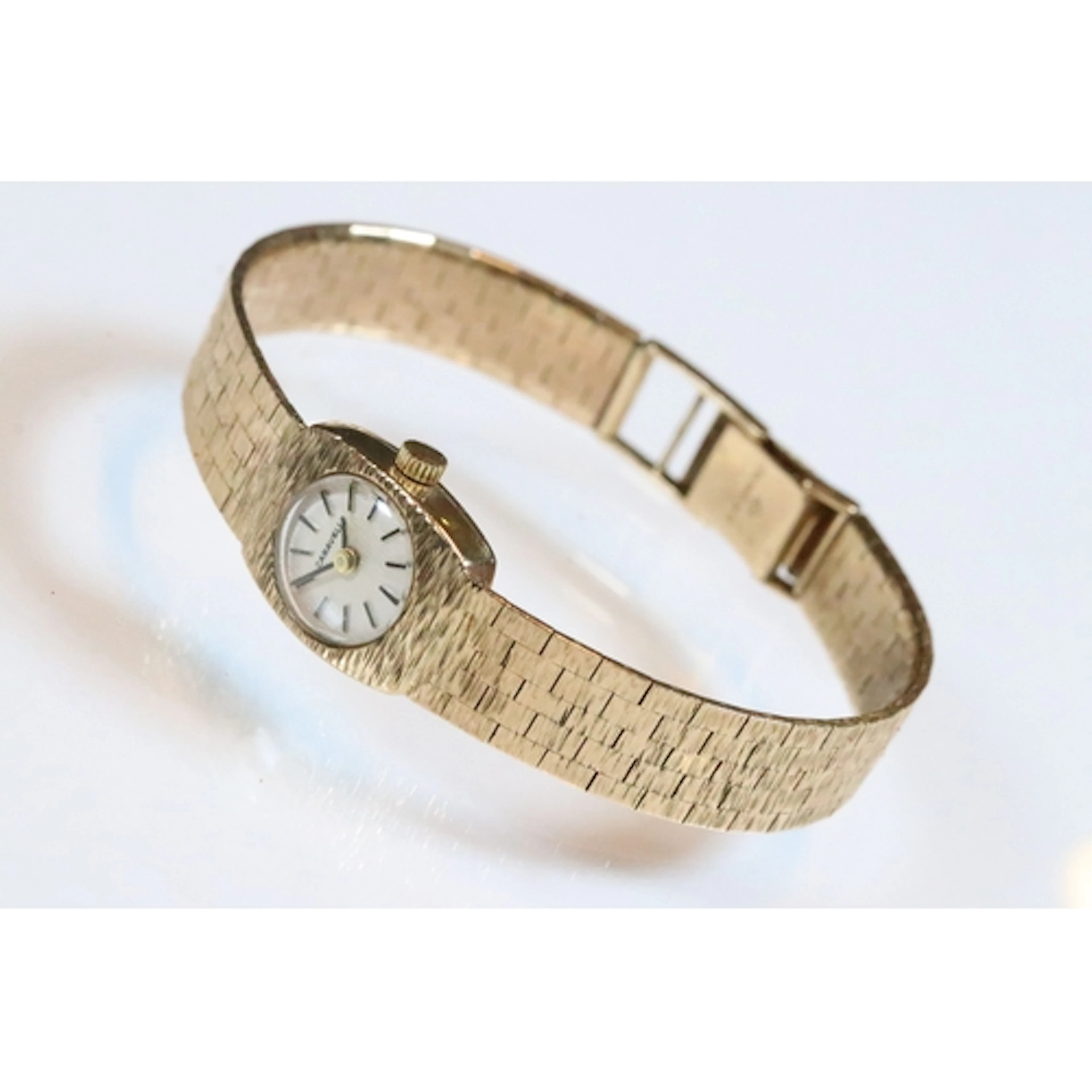 Ladies 9ct gold Caravelle wrist watch having a textured dial...
