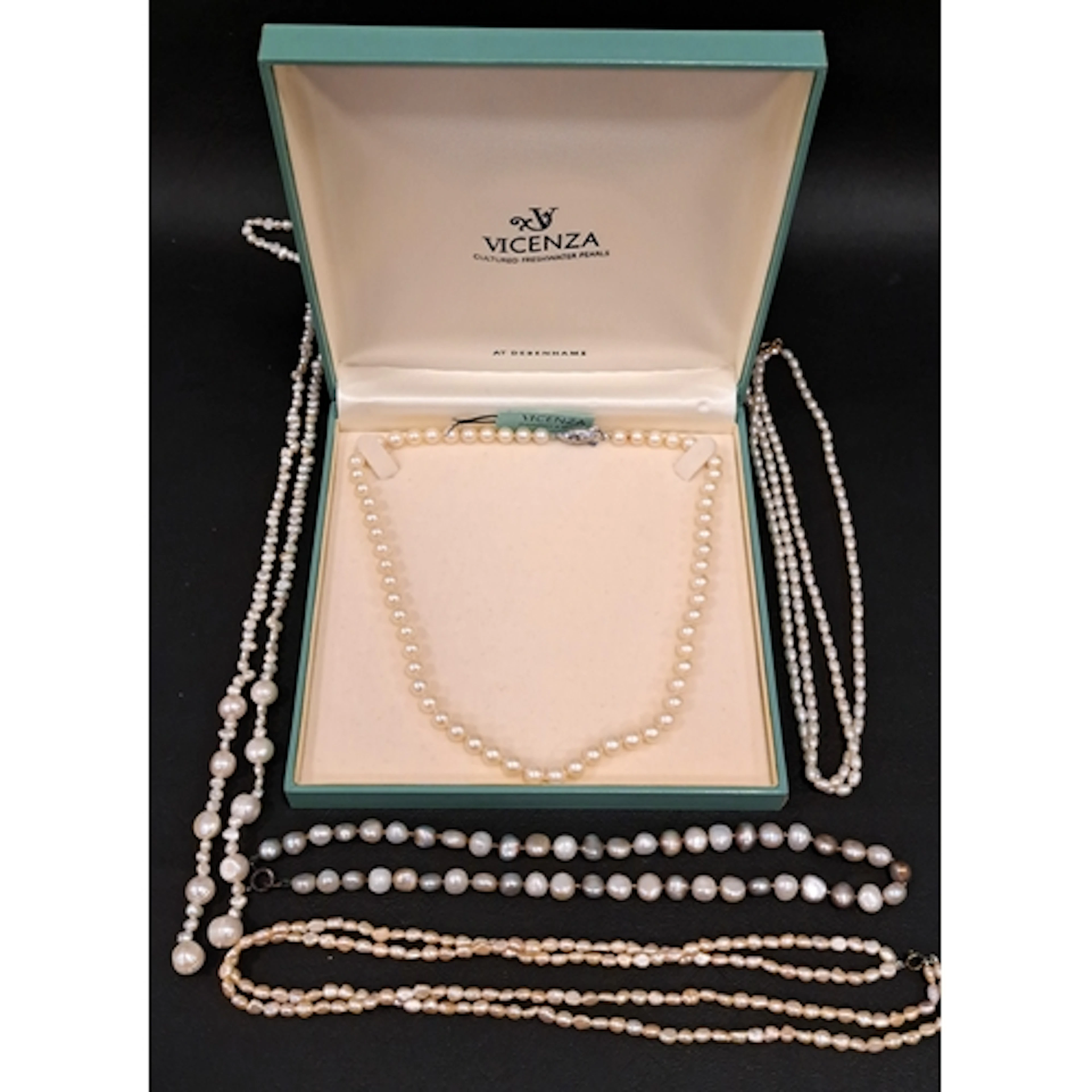 FOUR PEARL NECKLACES one double strand necklace with nine ca...