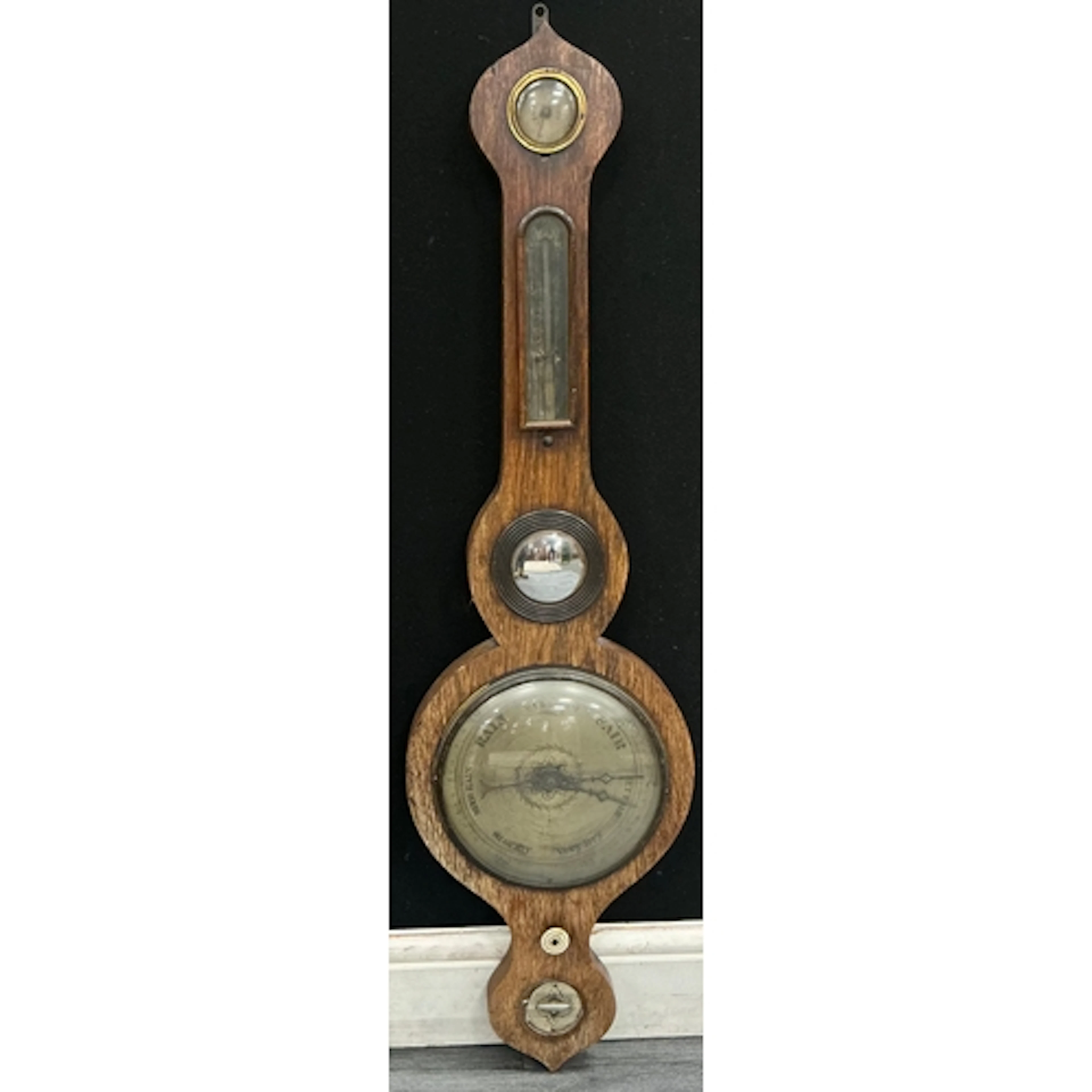 A 19th century five glass wheel barometer featuring a surfac...