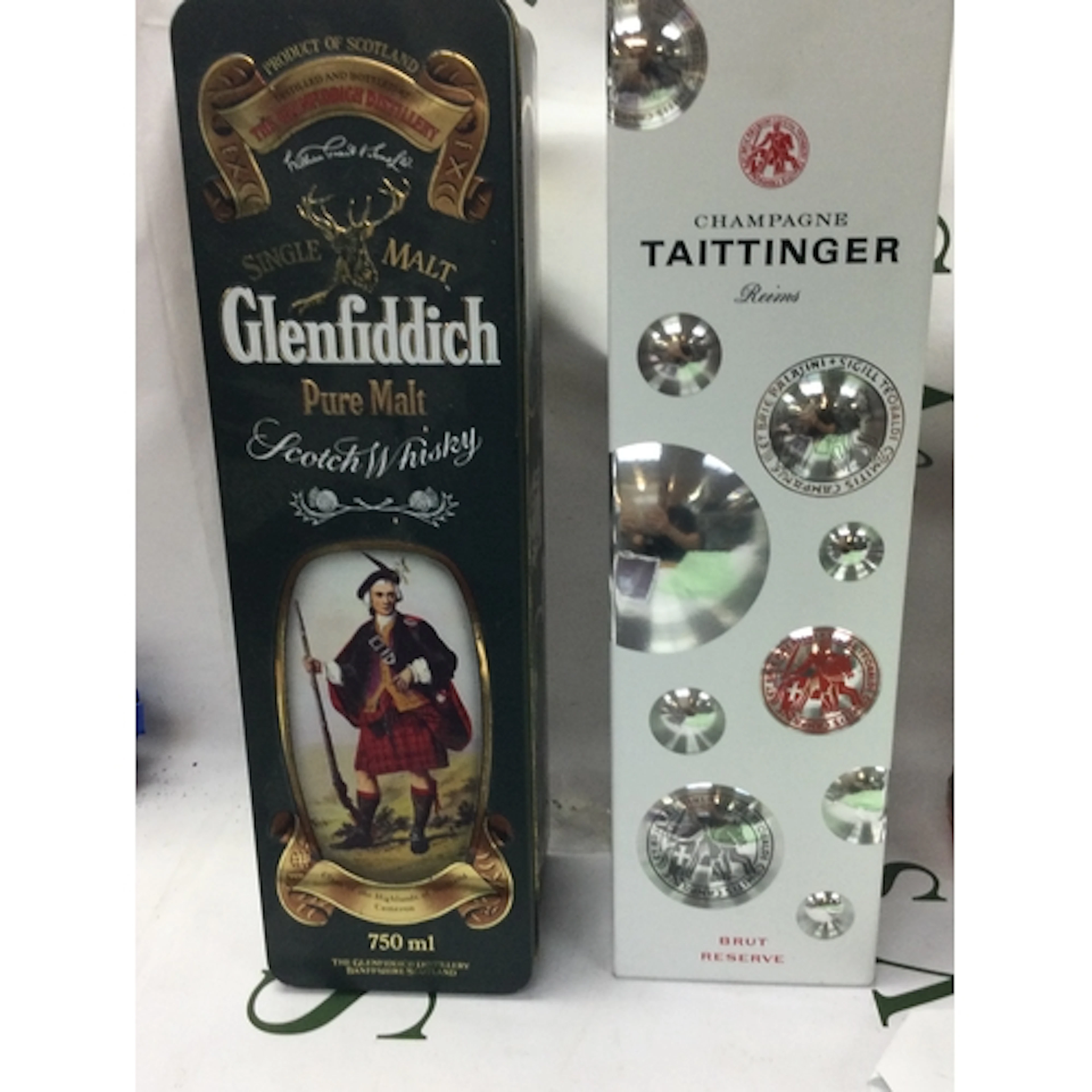 A Taittinger champagne and a bottle of Glenfiddich