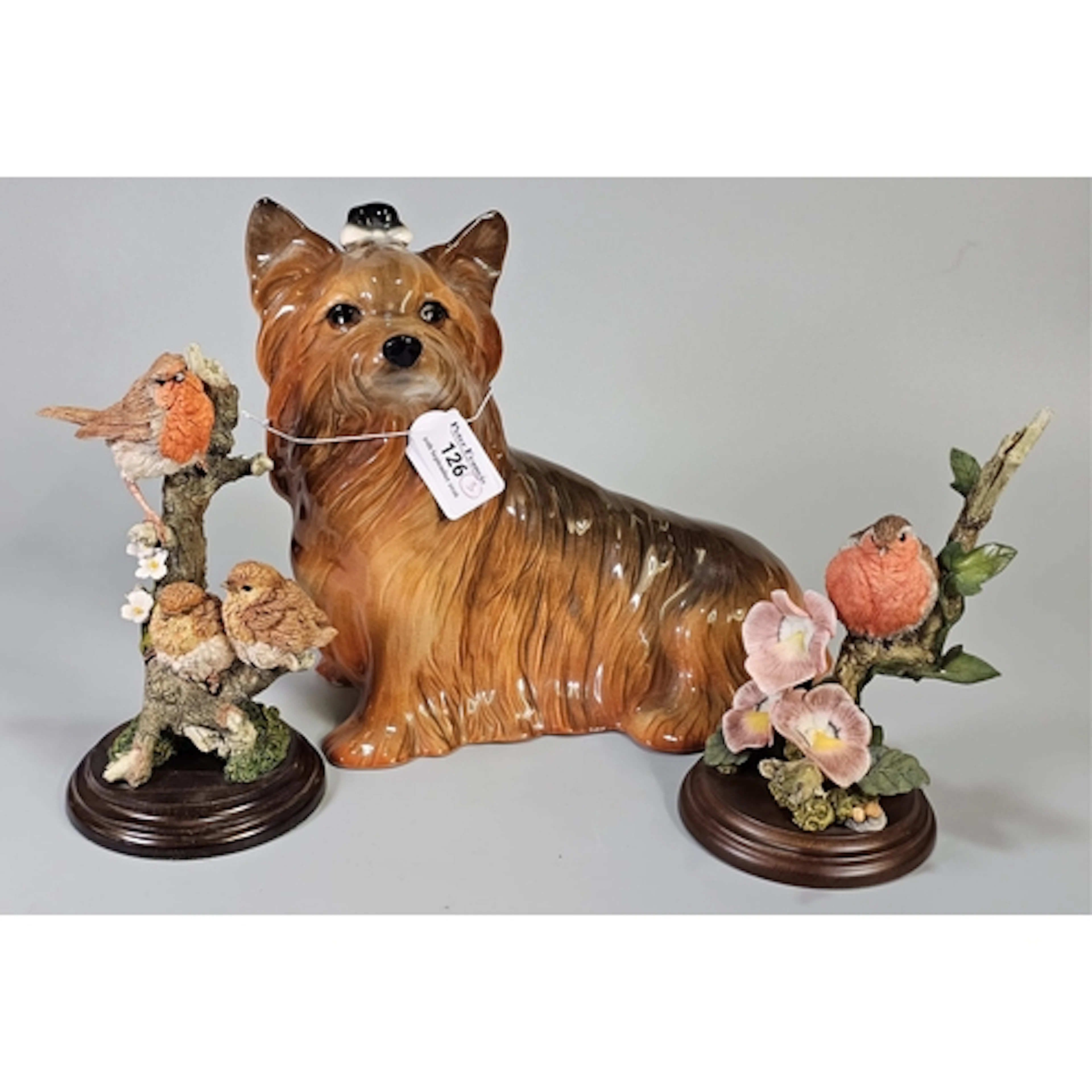 Pottery study of a seated Yorkshire Terrier, together with t...