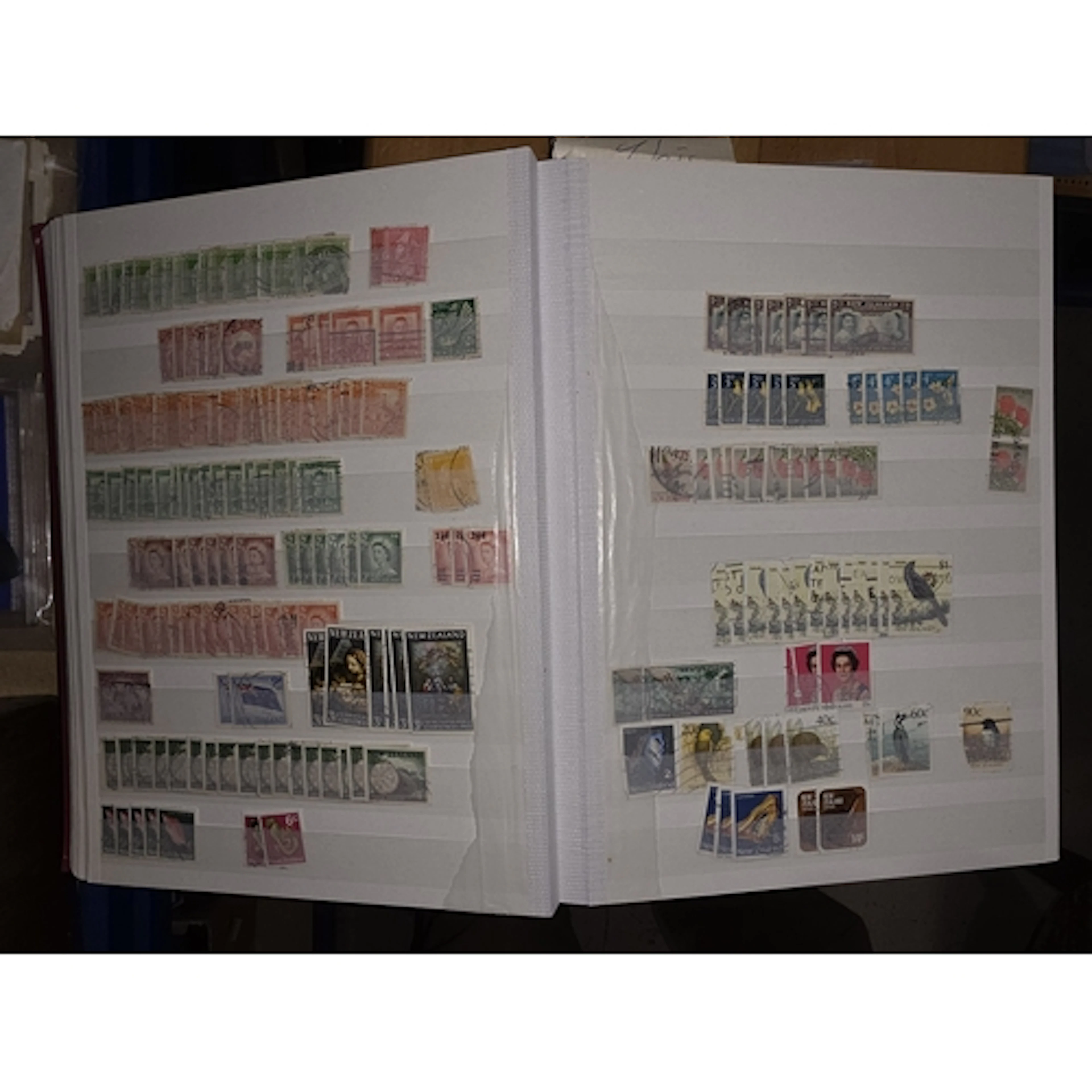 A stock book and album of Australian and New Zealand stamps;...