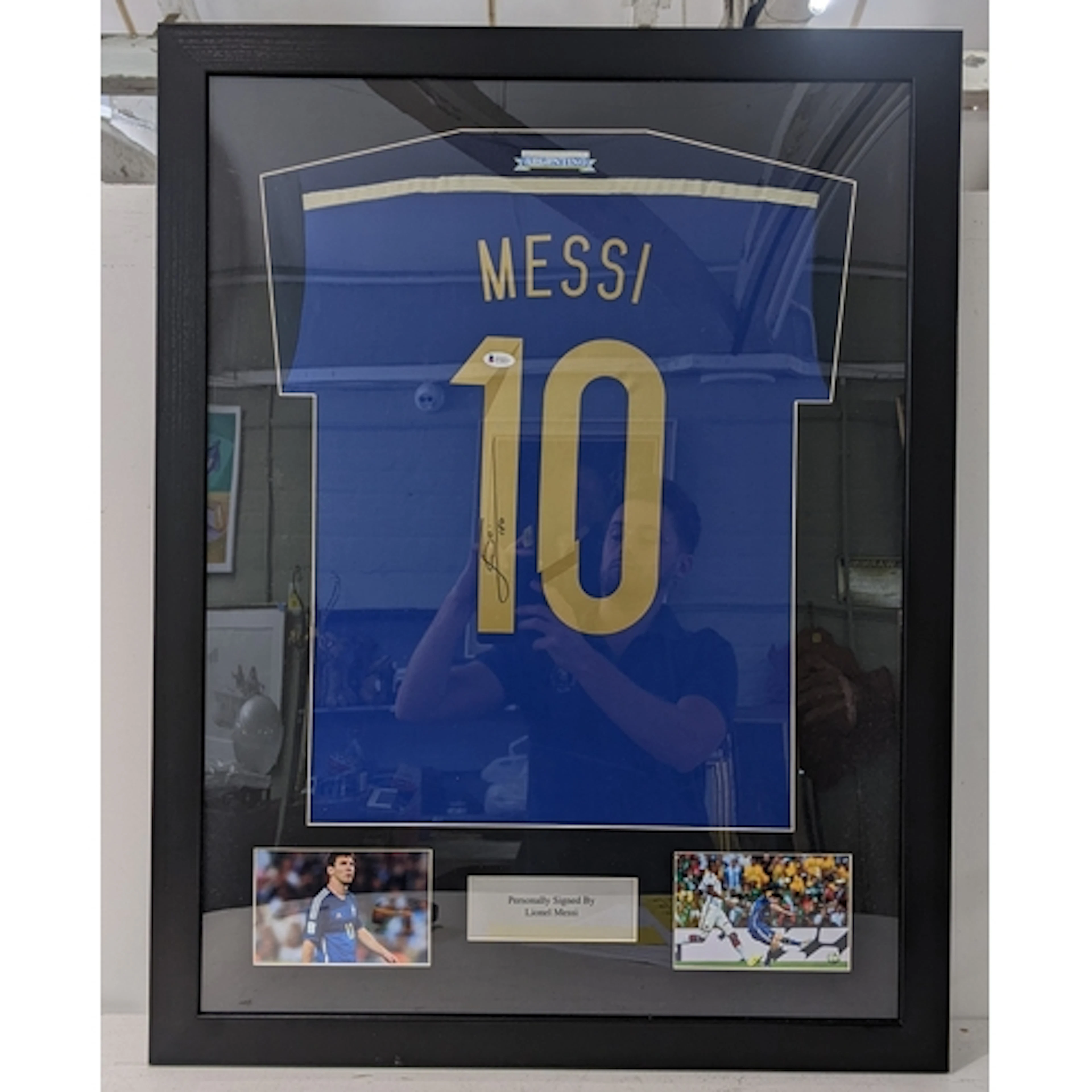 An Argentina framed football shirt signed by Lionel Messi wi...