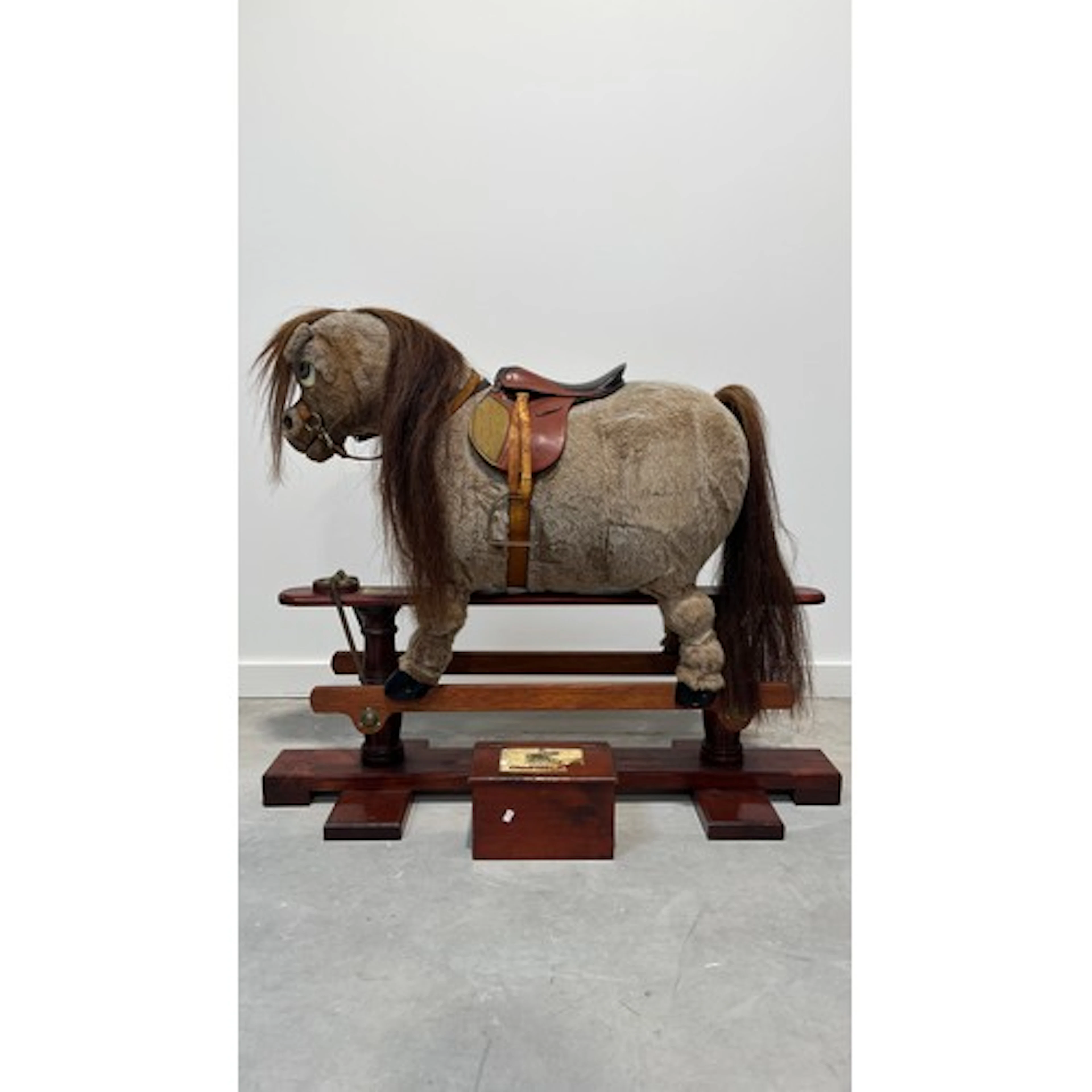 Norman Thelwell rocking horse on trestle stand, 113cm long.