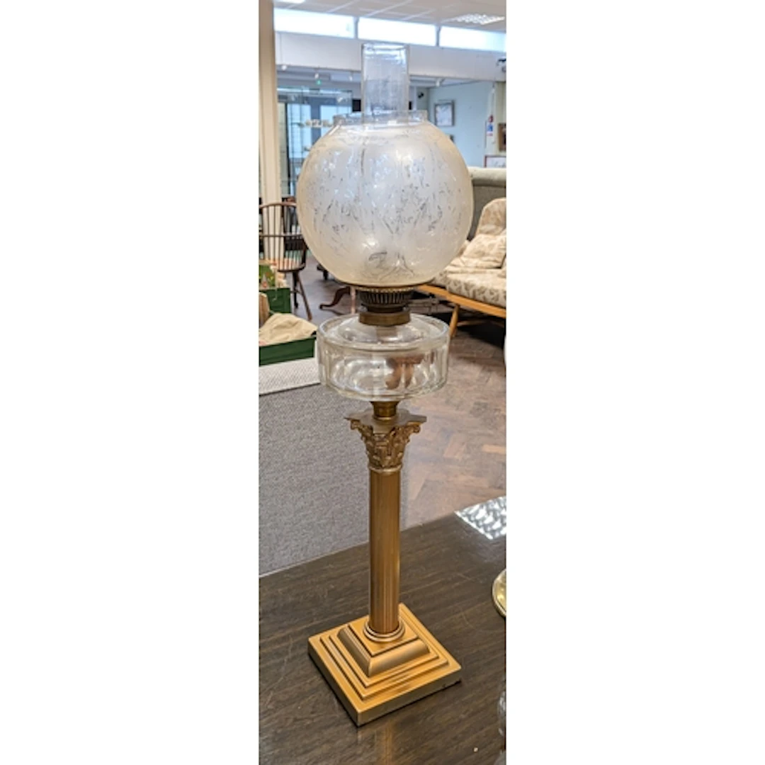 A Victorian brass Corinthian column oil lamp with glass bowl...