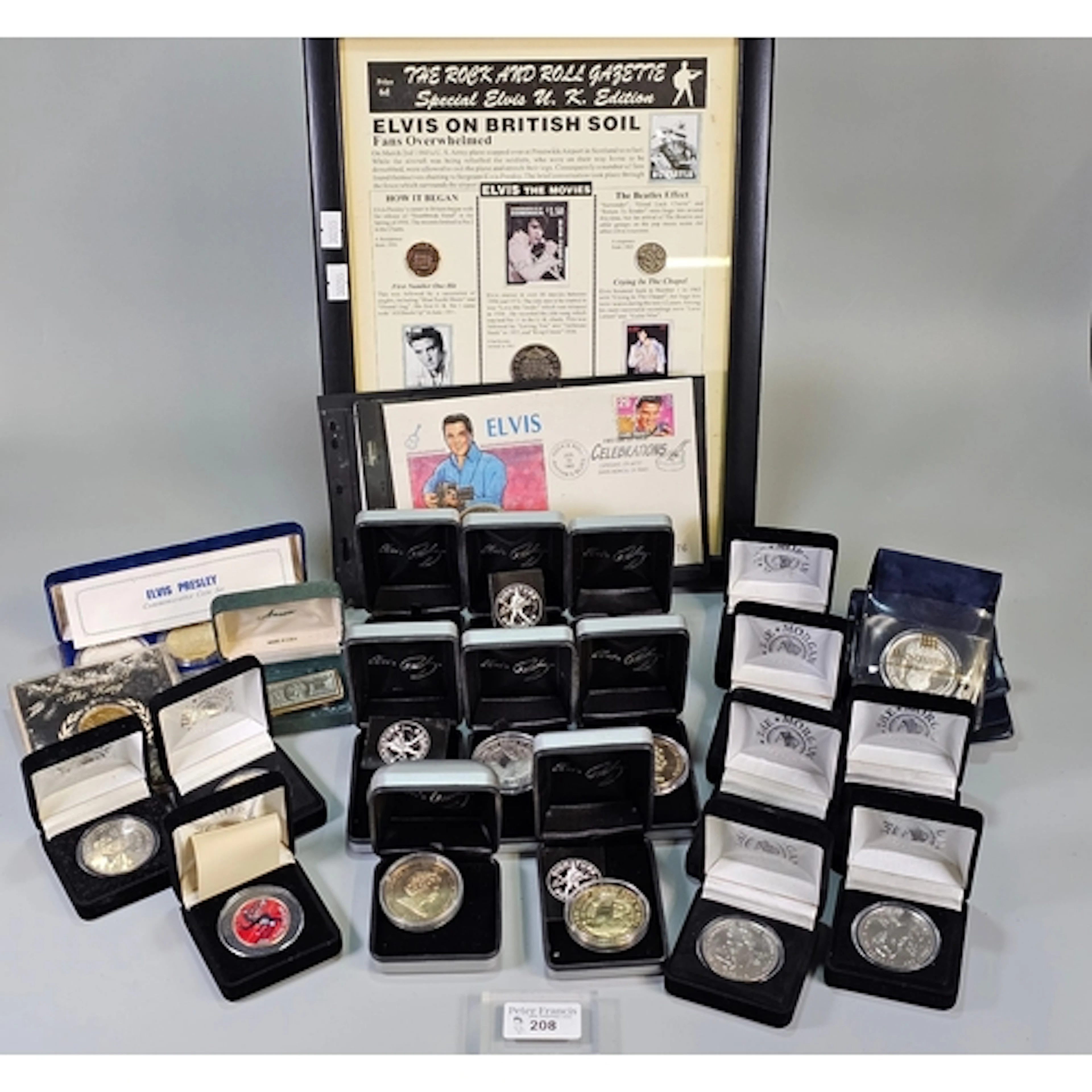A collection of Elvis Presley coinage to include framed 'The...