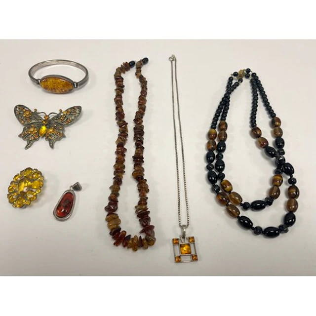 Amber style beads, pendants, brooches, etc.