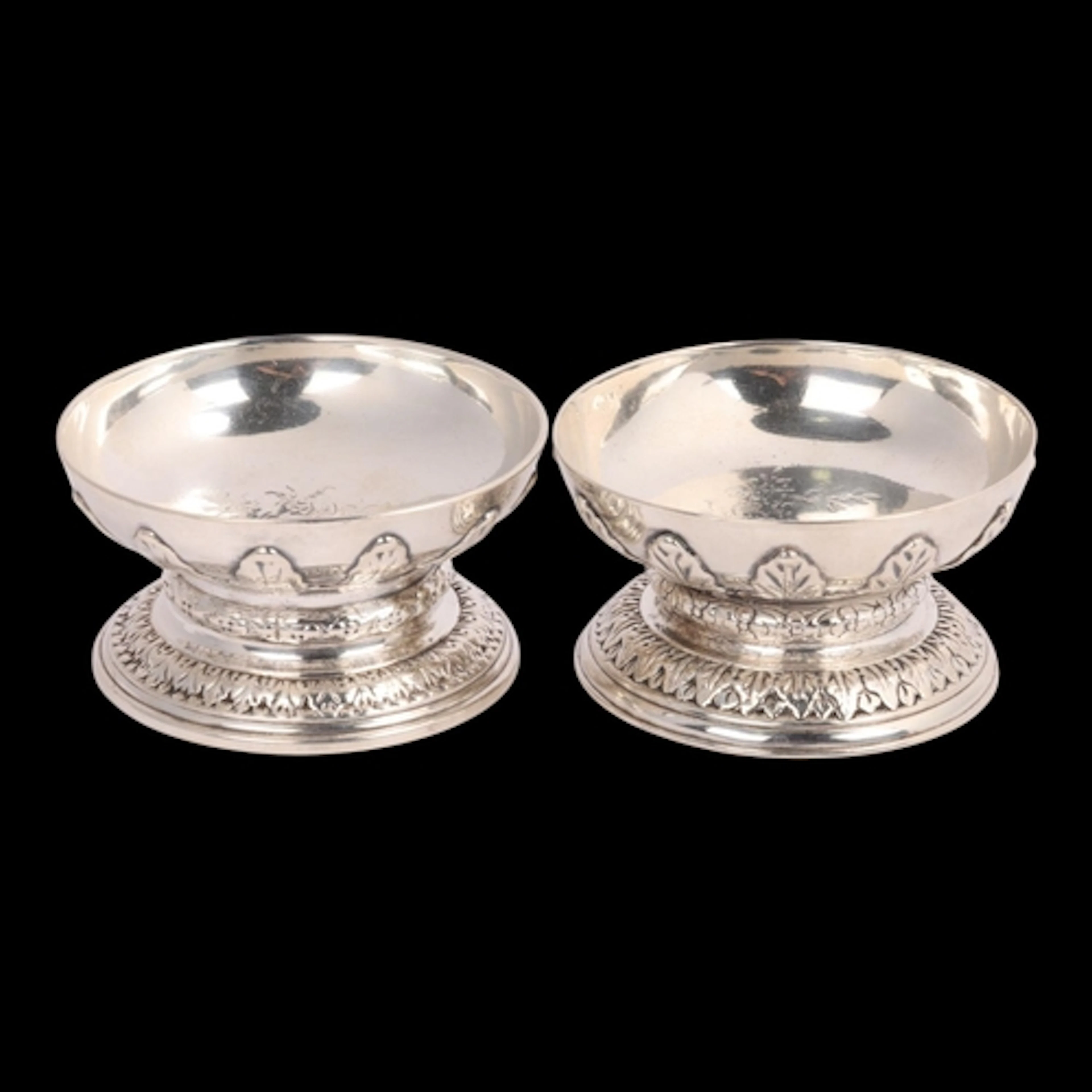 A matched pair of 18th century cast silver table salts, comp...