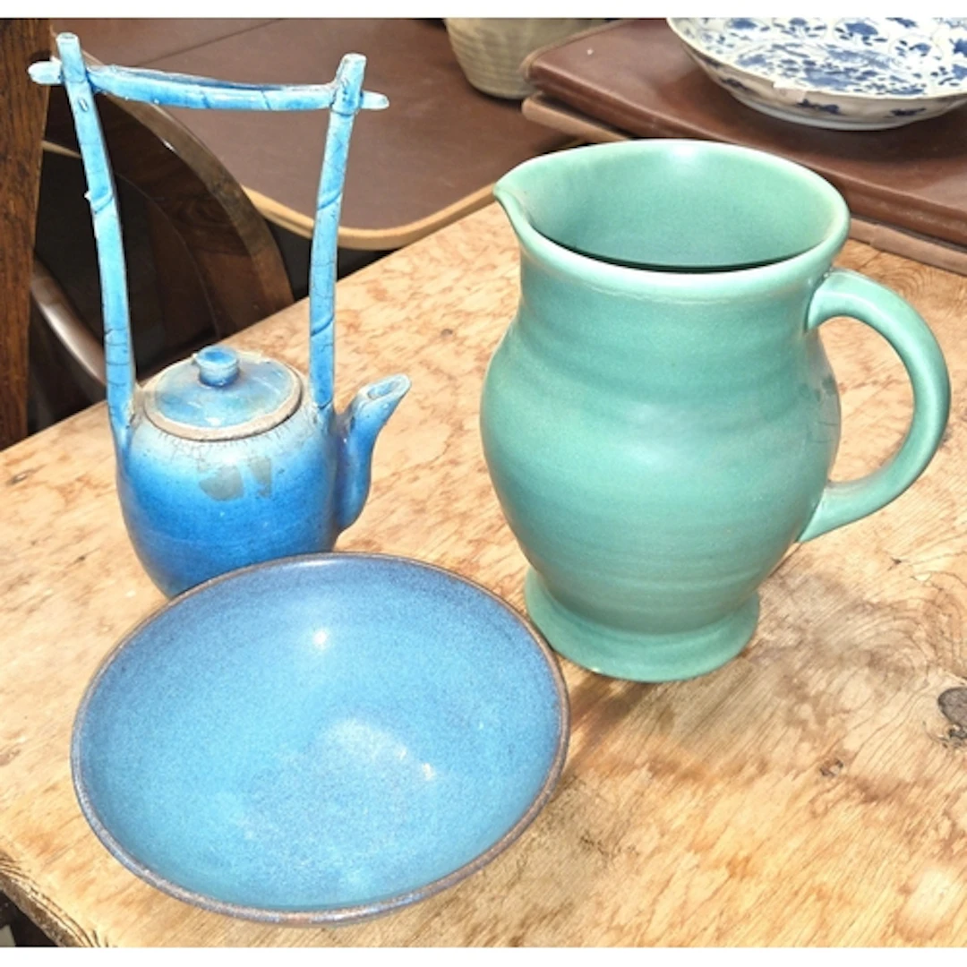 A David Holmes raku fired ceramic teapot; a signed studio po...