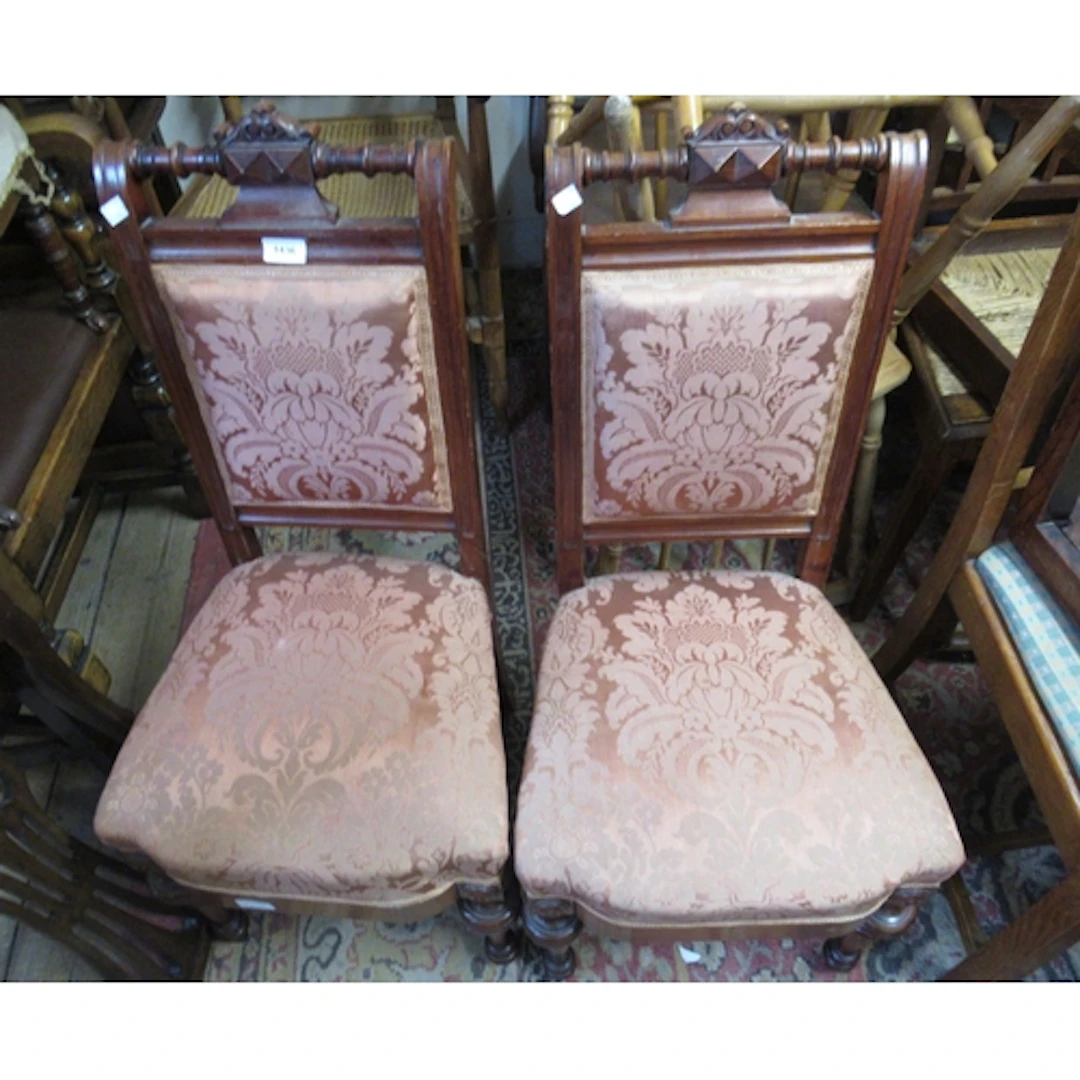 Pair of Continental mahogany side chairs, with turned carved...