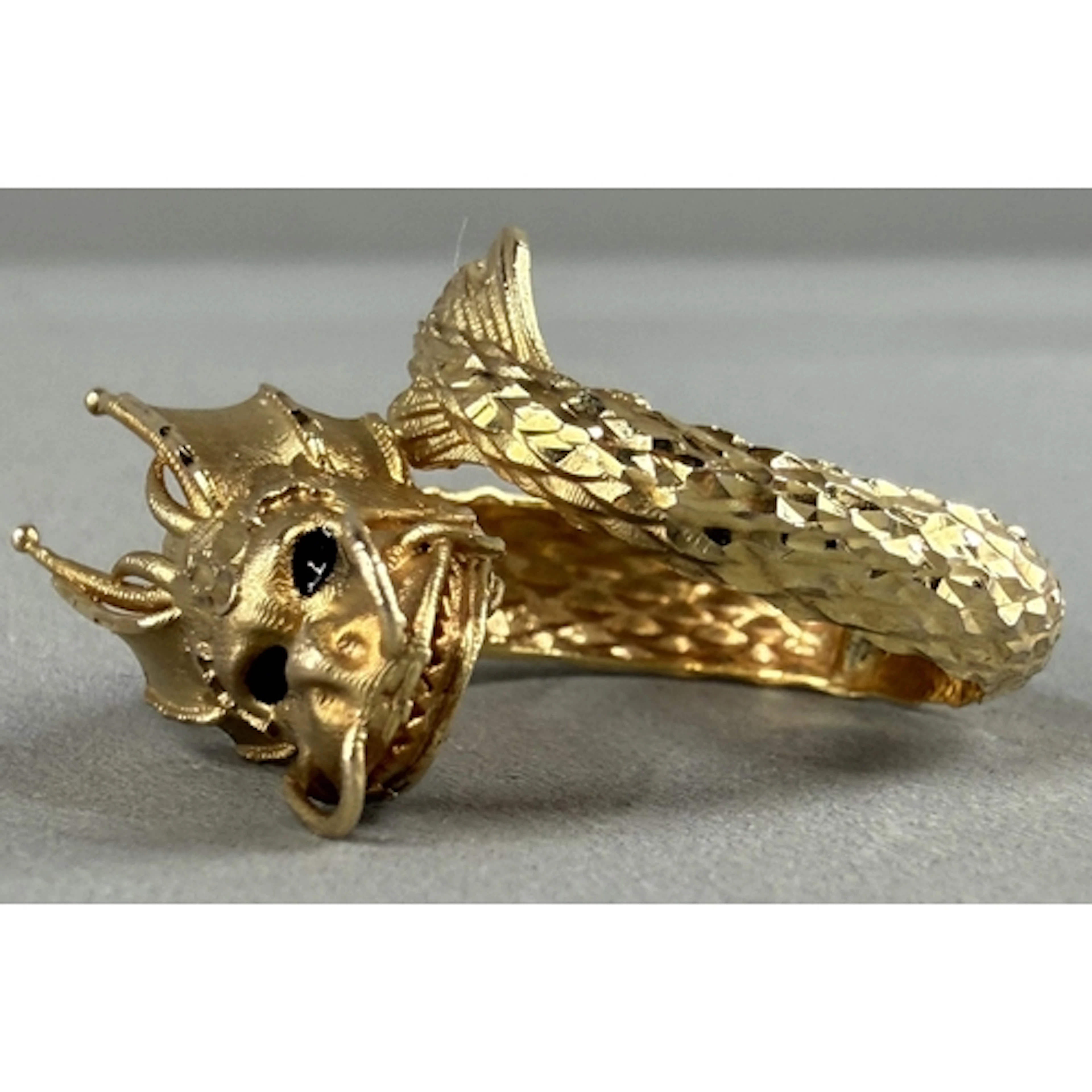 Jewellery: a yellow metal ring in the form of a dragon, the ...