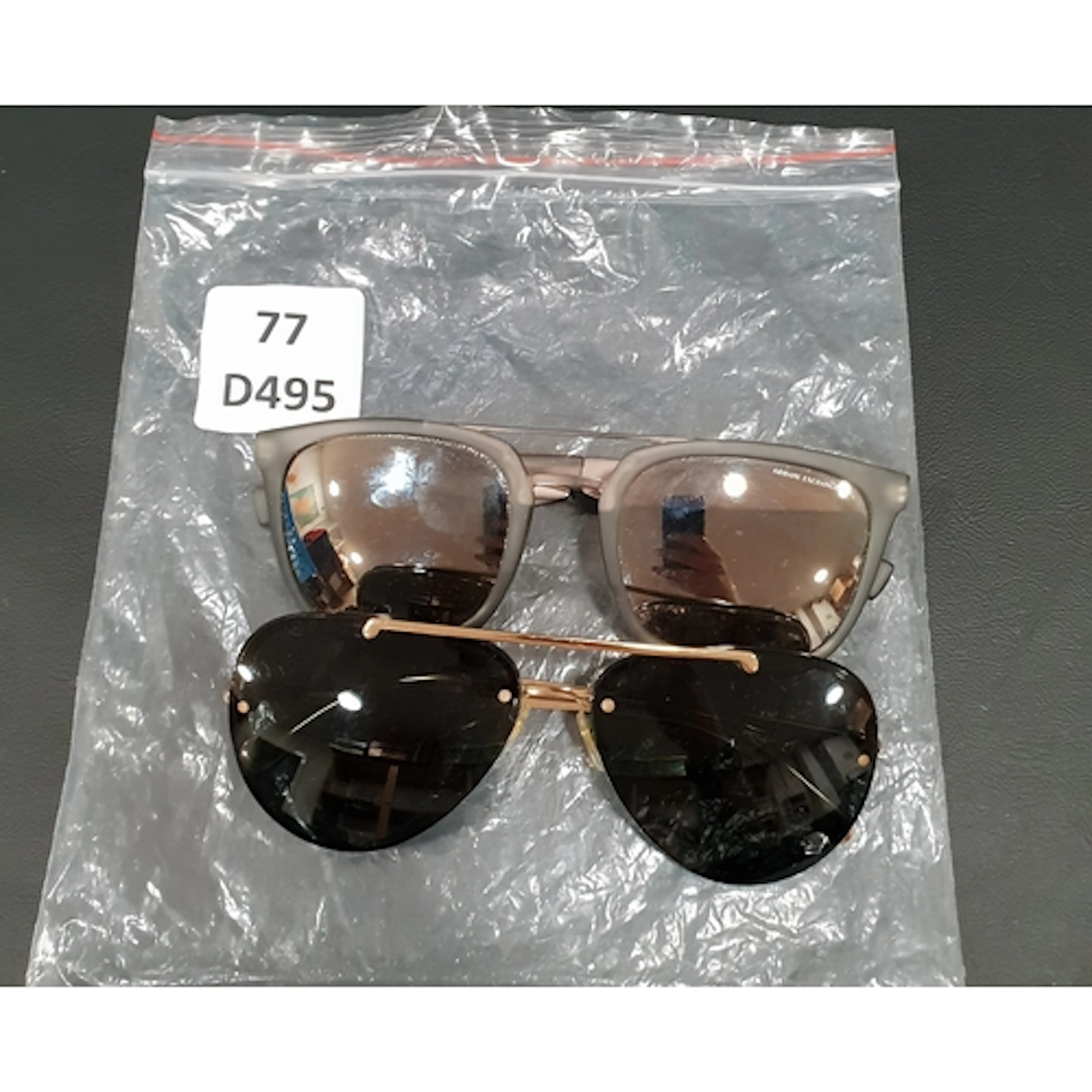 TWO PAIRS OF SUNGLASSES comprising Armani Exchange model AX...
